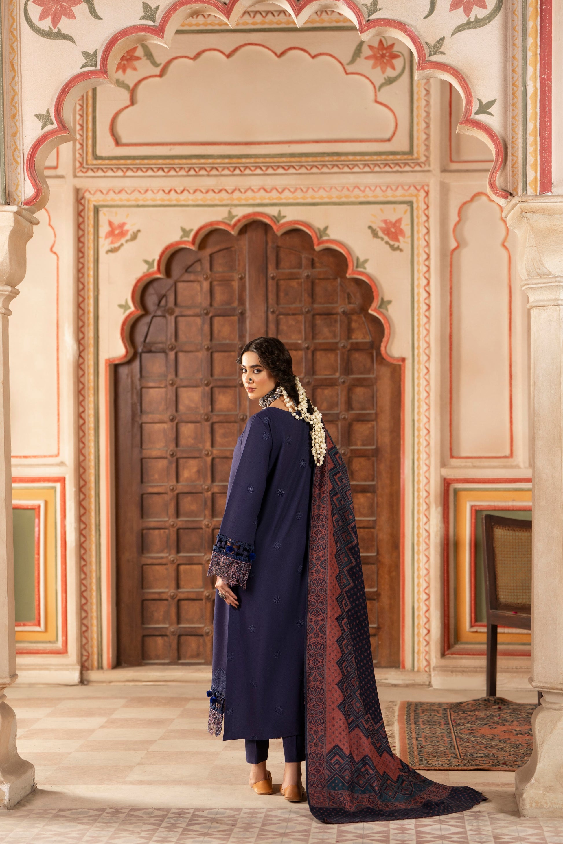Stylish unstitched winter suit designed with a soft jacquard wool shawl and intricate embroidered shirt