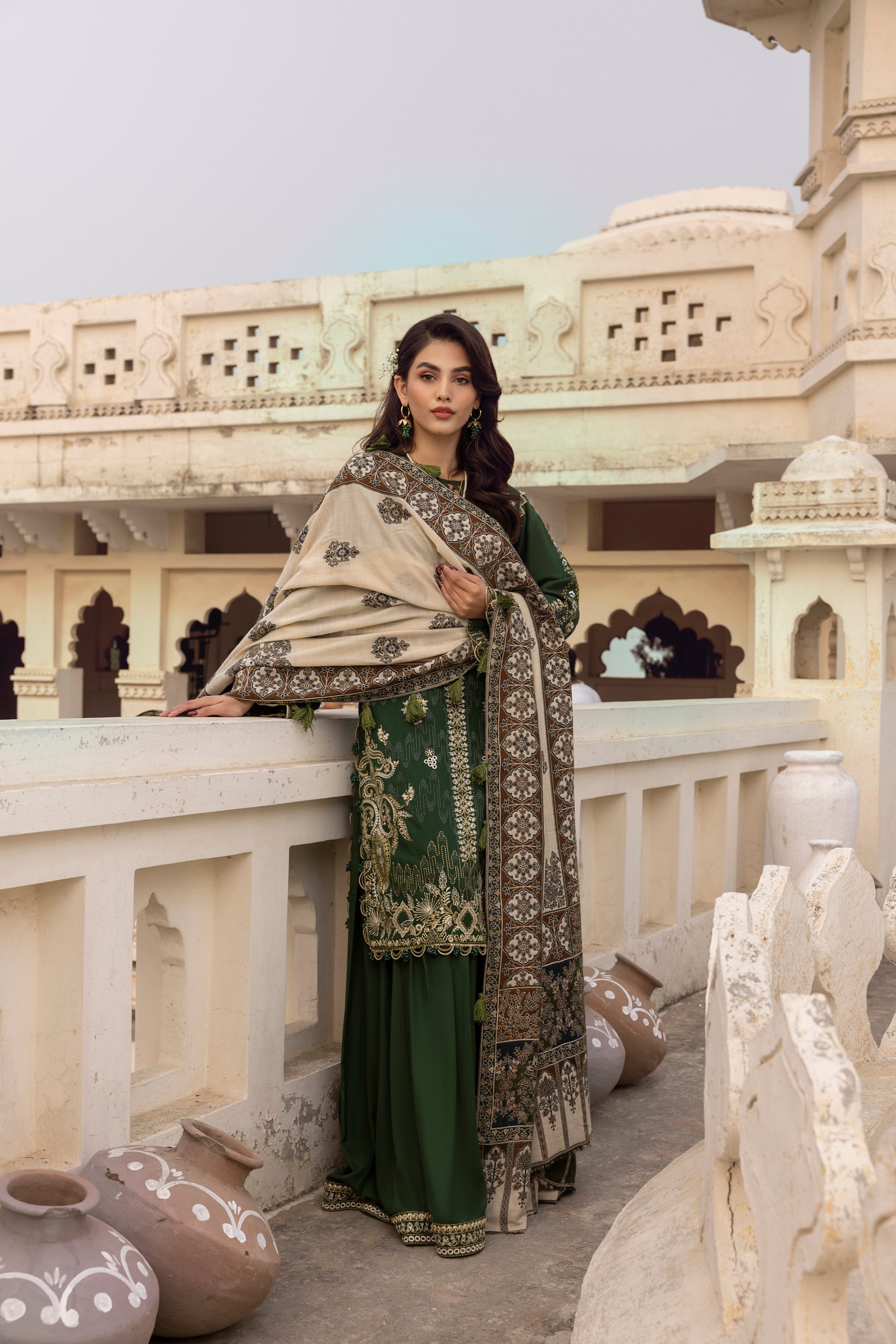 A refined winter outfit showcasing artisanal shawl weaving, Marina wool embroidery, and structured trousers.