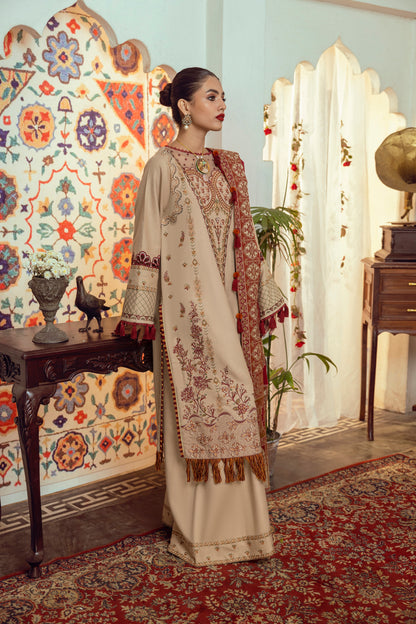 A pure wool winter attire offering Marina embroidery, organza detailing, and a fine woven Kashmiri shawl.