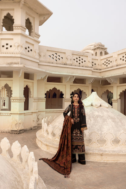 A warm winter outfit featuring a handcrafted Kashmiri shawl paired with an embroidered Marina shirt and tailored trousers.
