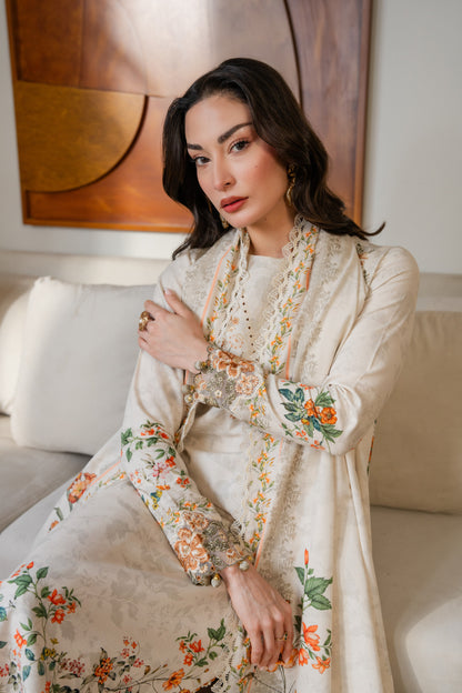Warm khaddar printed suit with simple organza detailing and winter dupatta.