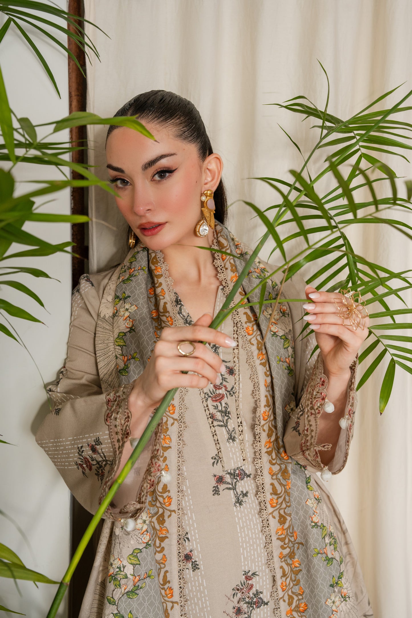 Modern winter khaddar dress with embroidered borders and dyed trousers.