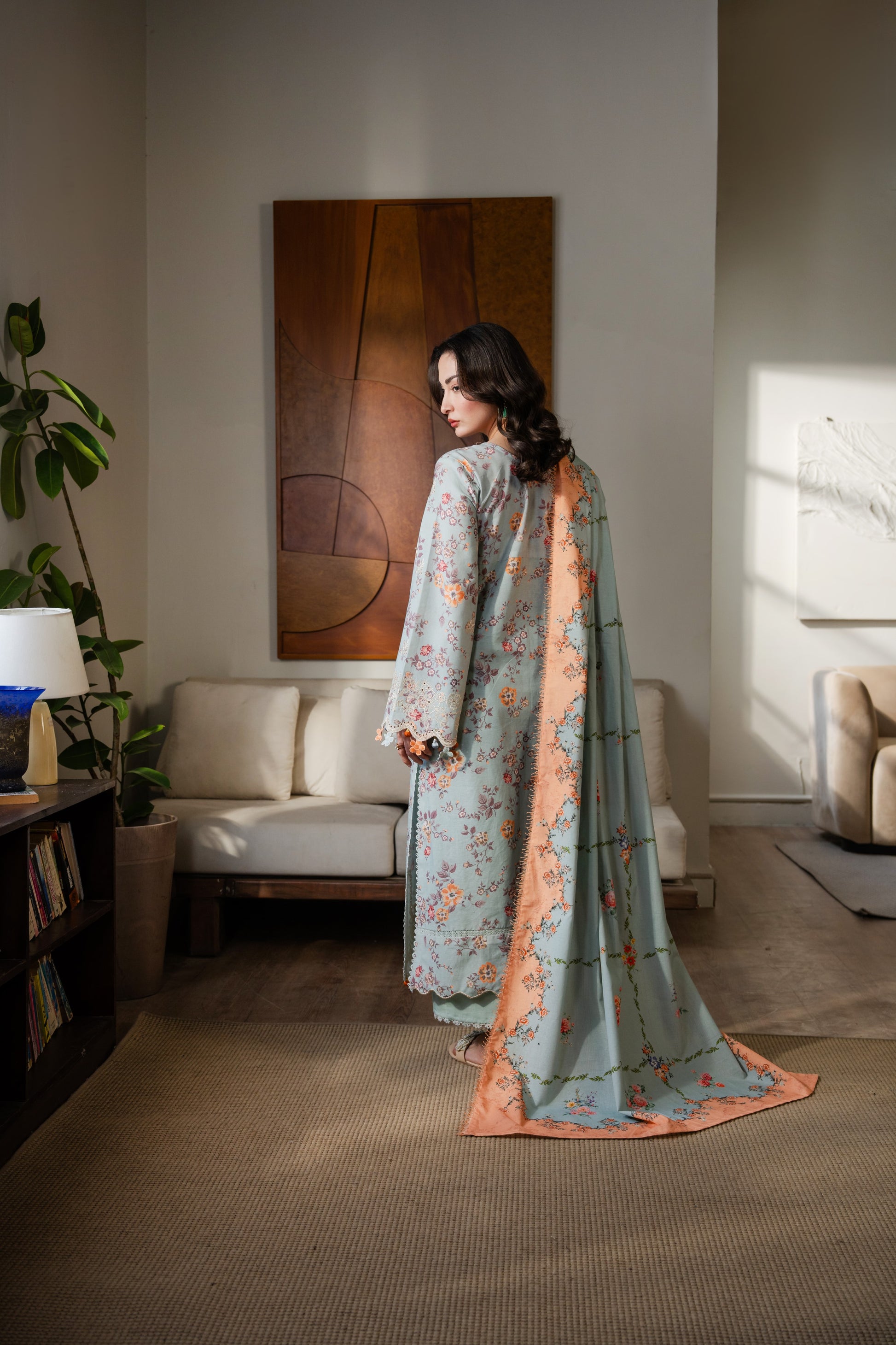 Warm winter dress with organza work, printed dupatta, and straight dyed trousers.