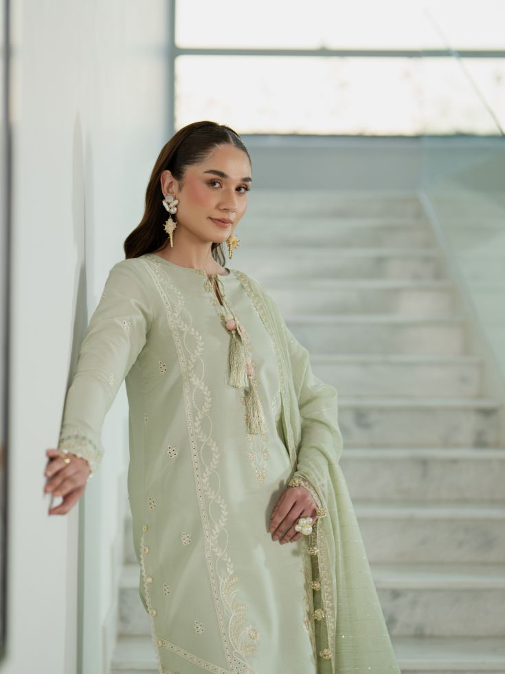 Embroidered lawn outfit featuring eastern style motifs and cotton dupatta