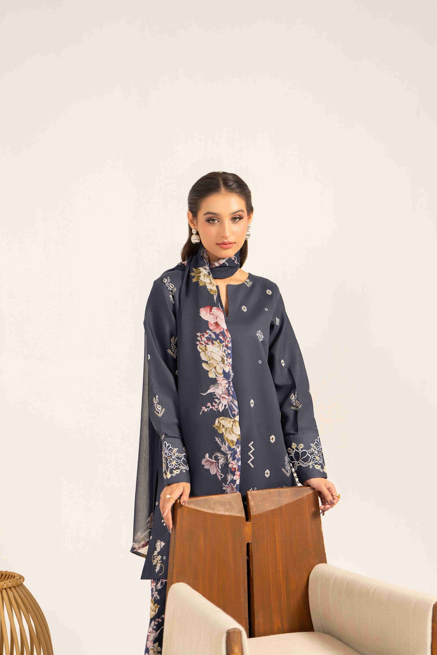 Classy embroidered lawn shirt styled with colorful chiffon dupatta and cotton trouser.