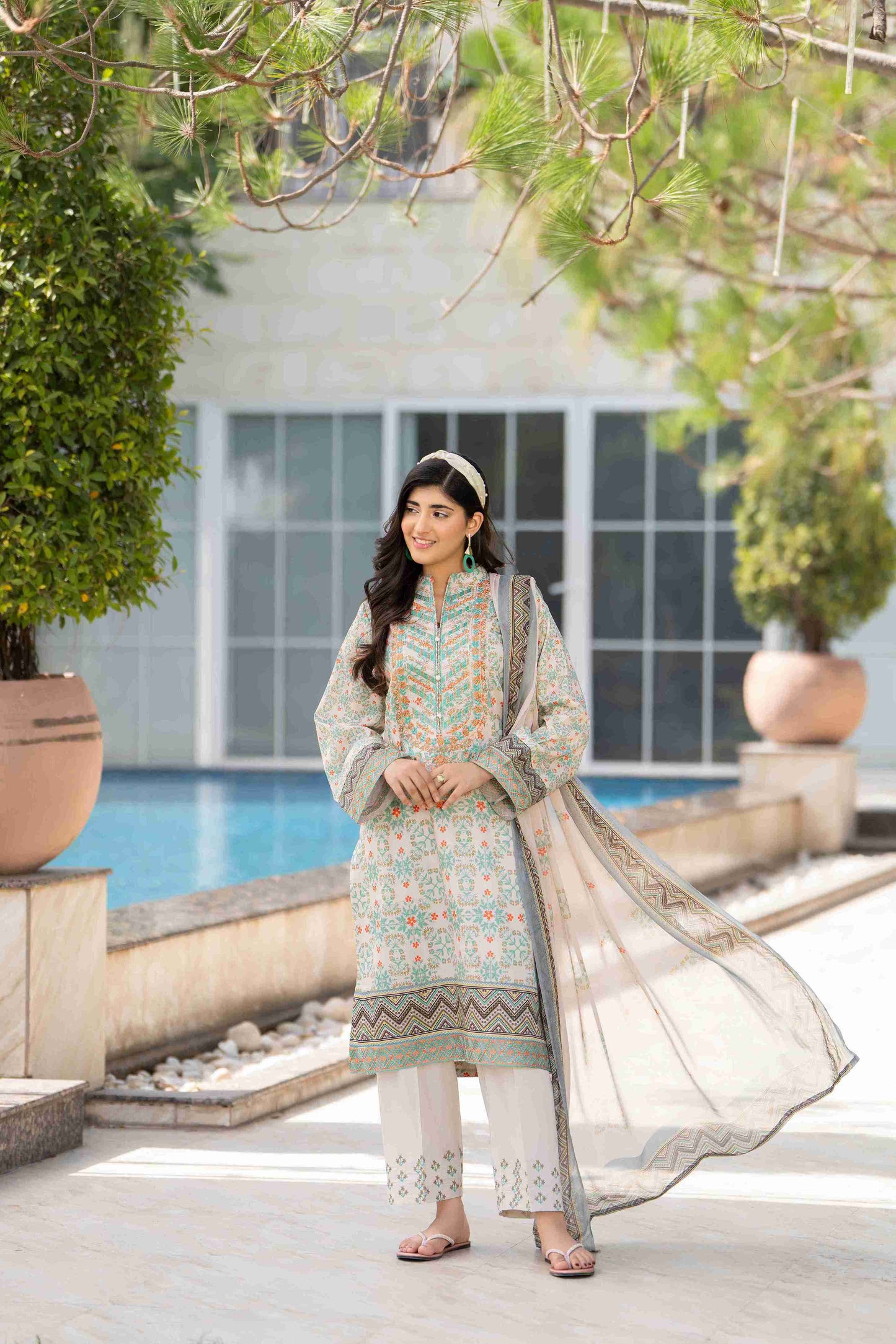 Unique lawn outfit featuring embroidered neckline, airy chiffon dupatta, and modern cotton trouser