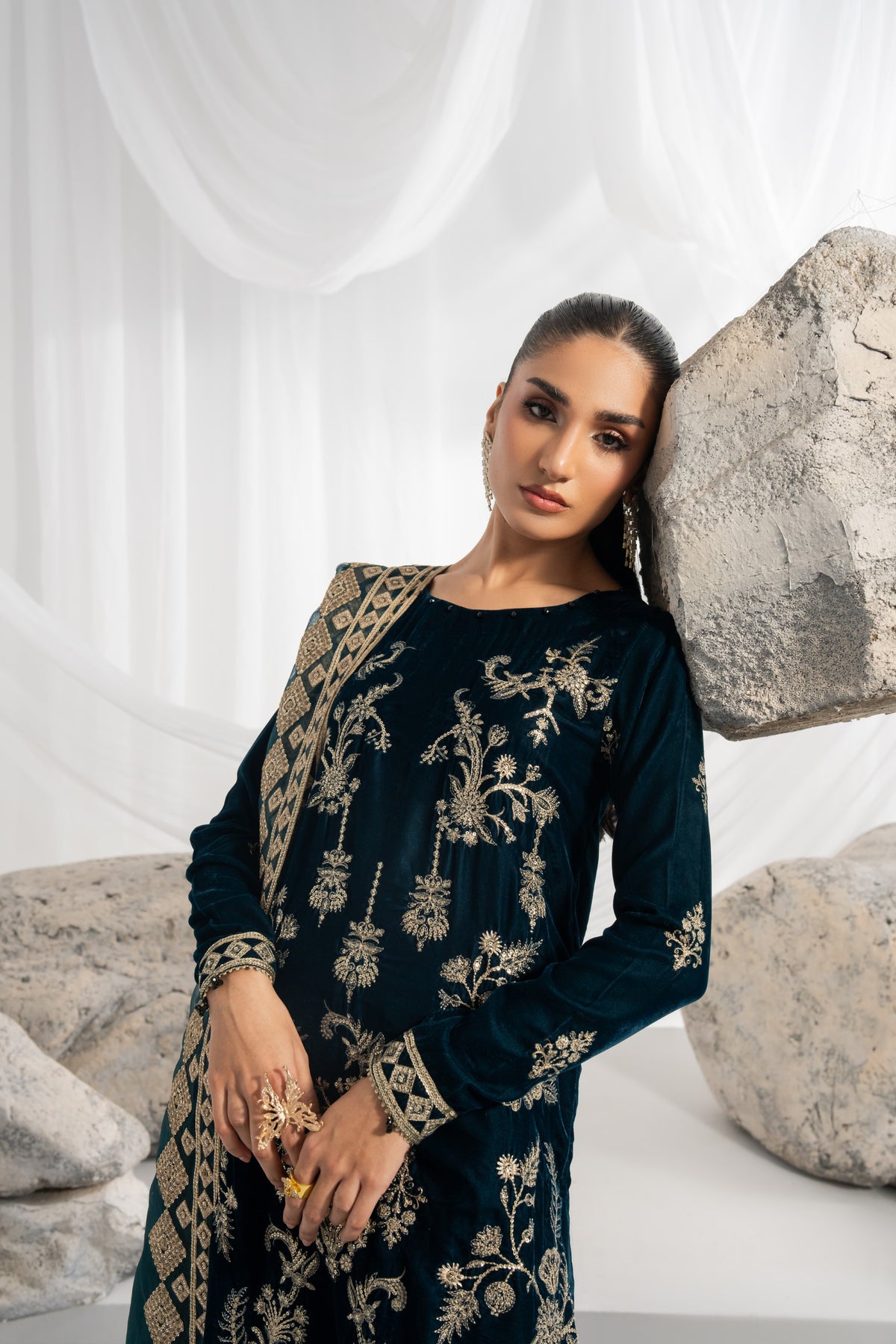 Luxury embroidered velvet outfit featuring a detailed velvet shirt with front and back embroidery, decorated sleeves and matching borders, complemented by an embroidered organza dupatta with pallu detailing and raw silk pants