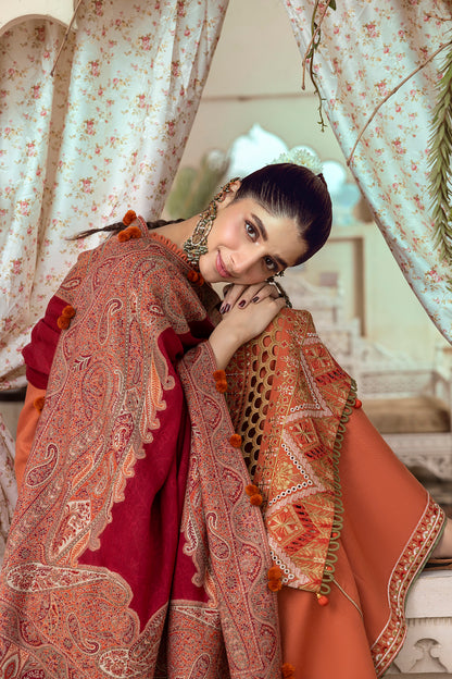 A cool-tone winter outfit with embroidery and a soft shawl.