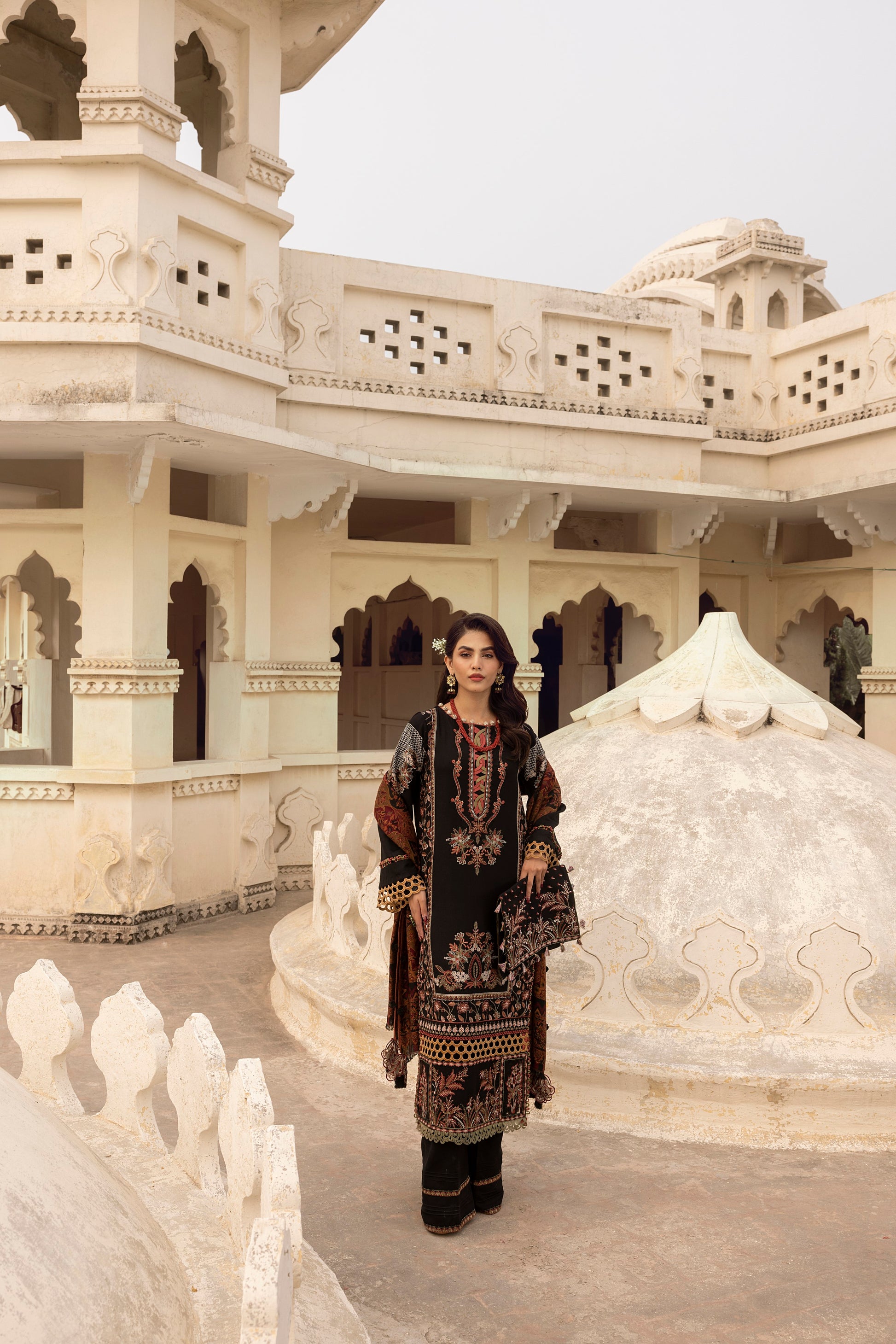 Chic seasonal design with an embroidered Marina shirt front, organza neck texture, and hand-detailed Kashmiri shawl.