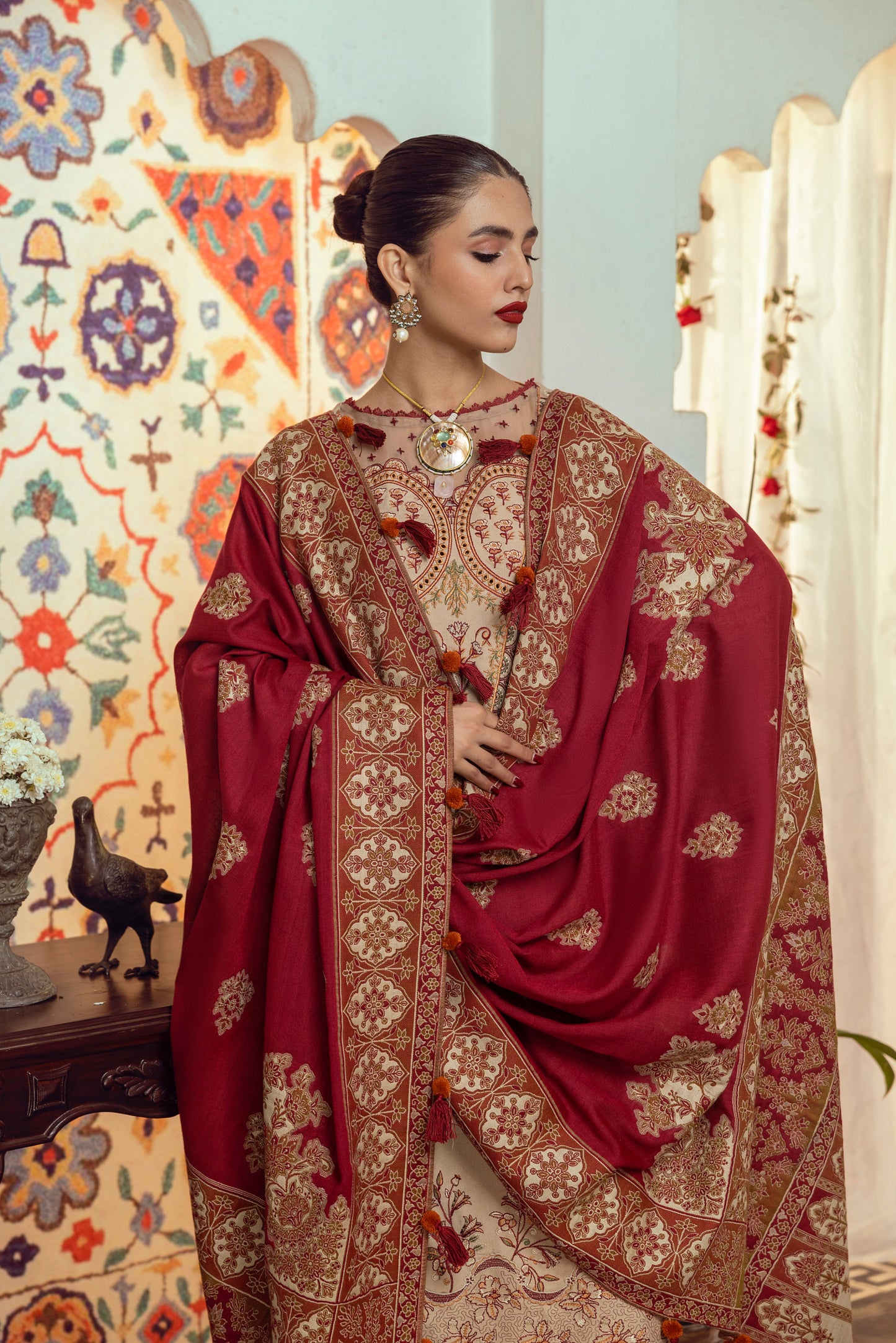 A refined winter outfit crafted from Marina wool with front embroidery, an organza neck patch, and a handwoven Kashmiri shawl for elevated seasonal style.