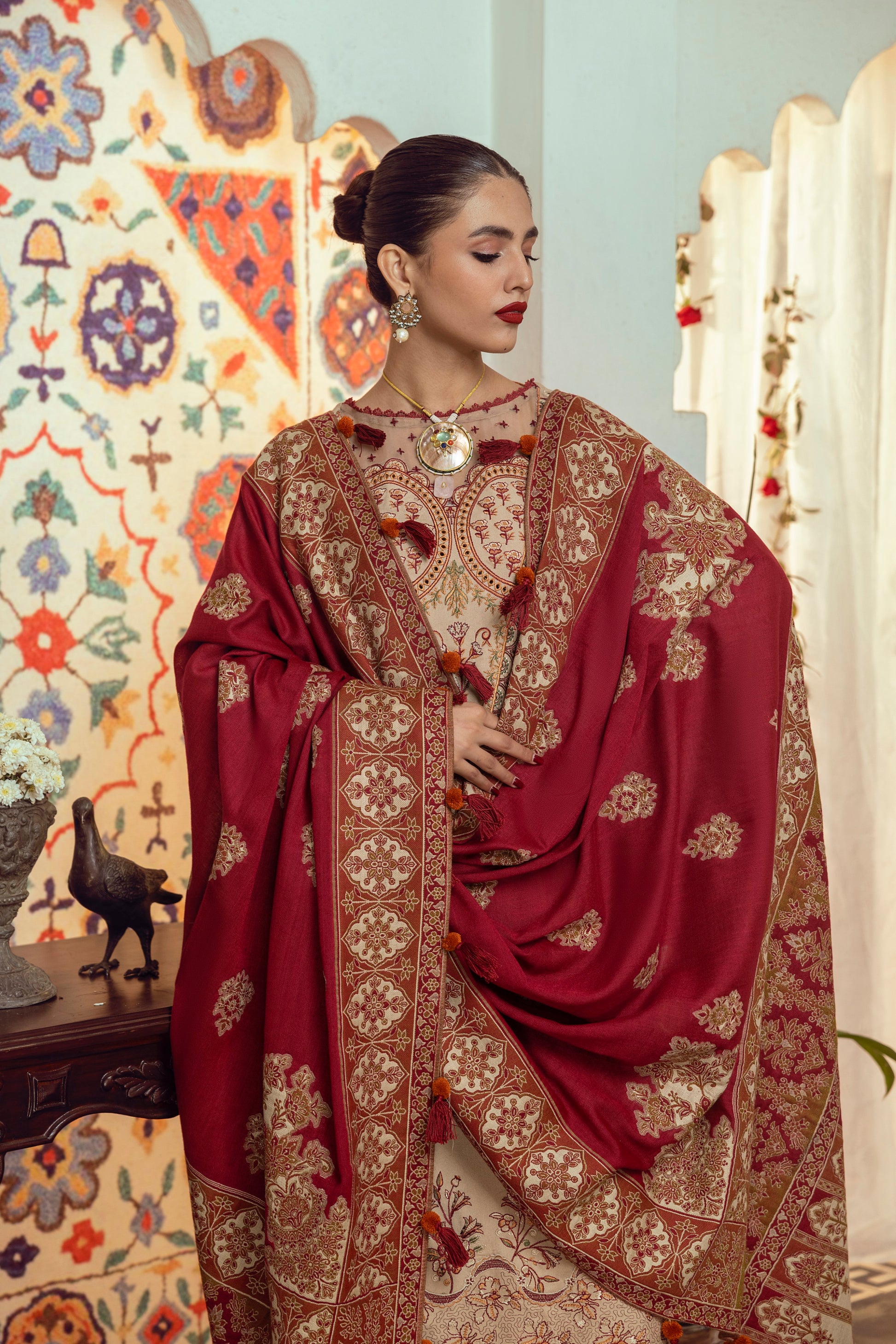 A refined winter outfit crafted from Marina wool with front embroidery, an organza neck patch, and a handwoven Kashmiri shawl for elevated seasonal style.