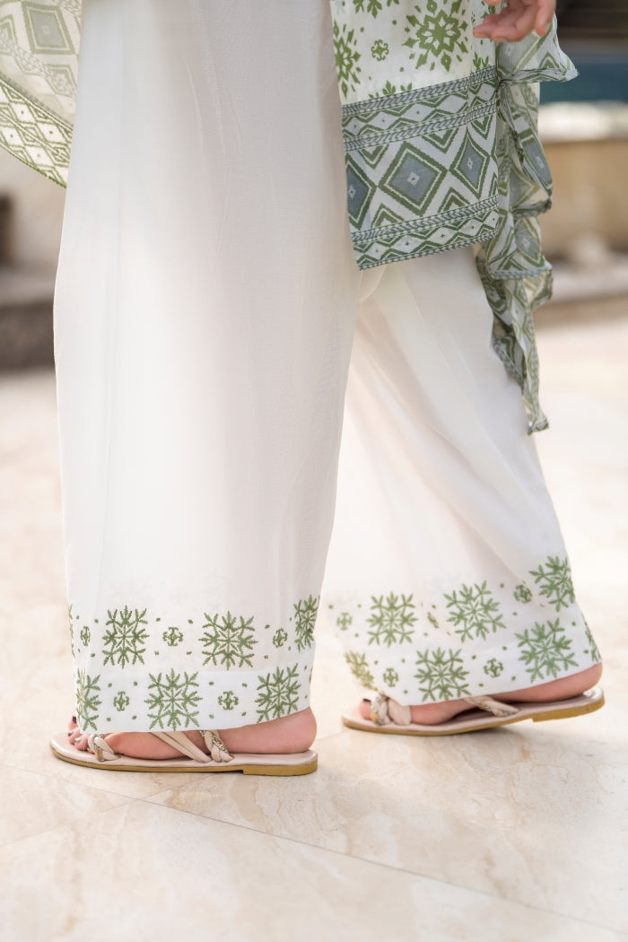 Printed lawn kurta with an embroidered neckline, styled with a simple trouser and light chiffon dupatta for a fresh look