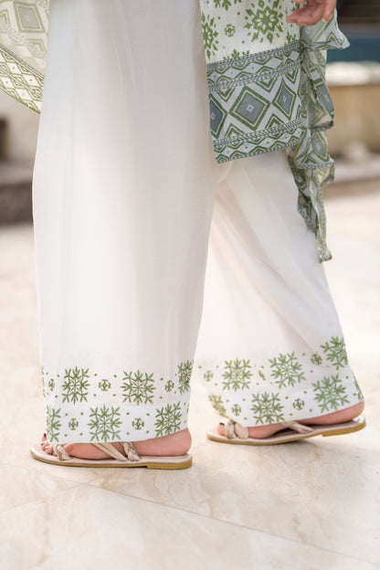 Printed lawn kurta with an embroidered neckline, styled with a simple trouser and light chiffon dupatta for a fresh look