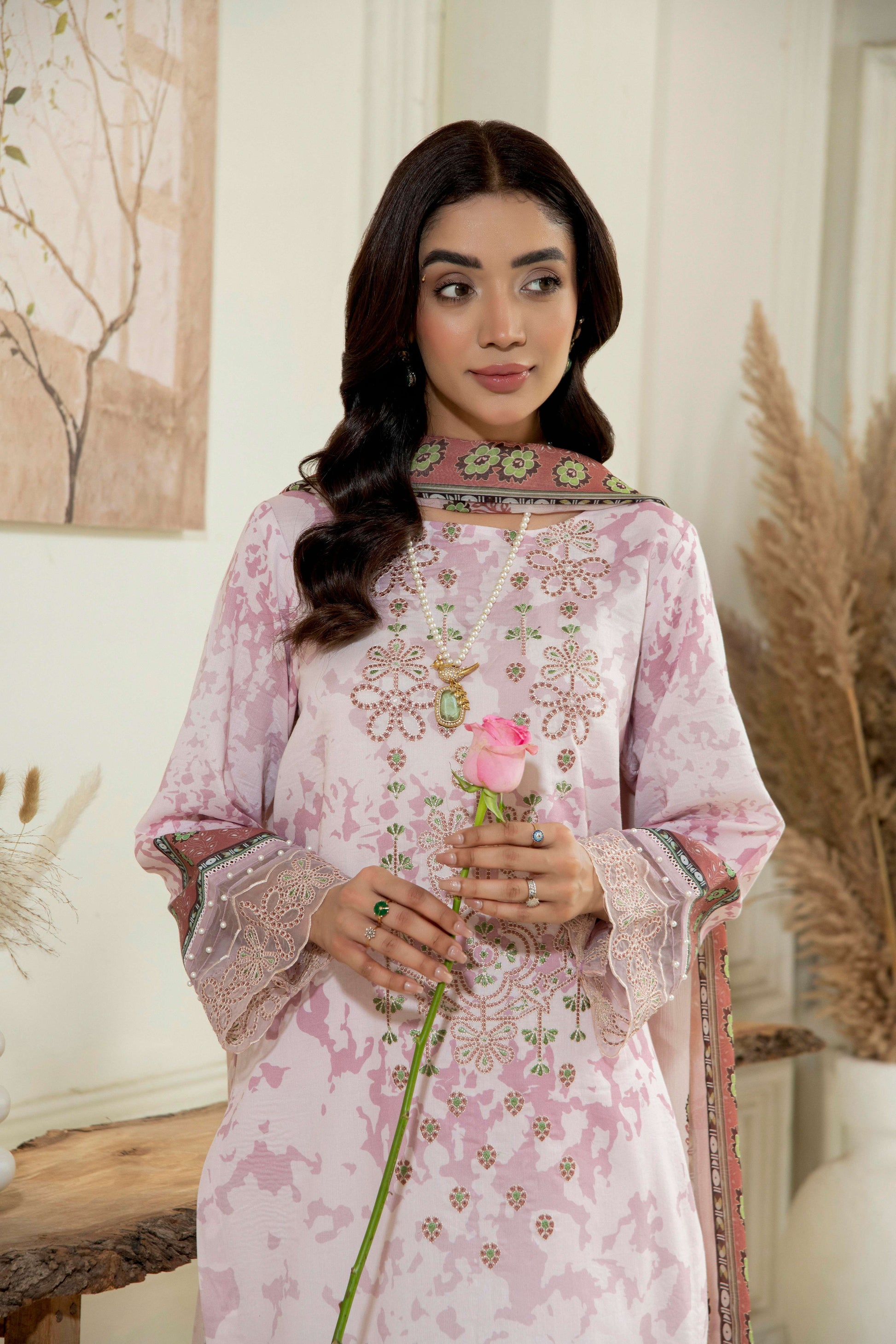  Lawn kurta with embroidery around the neckline.