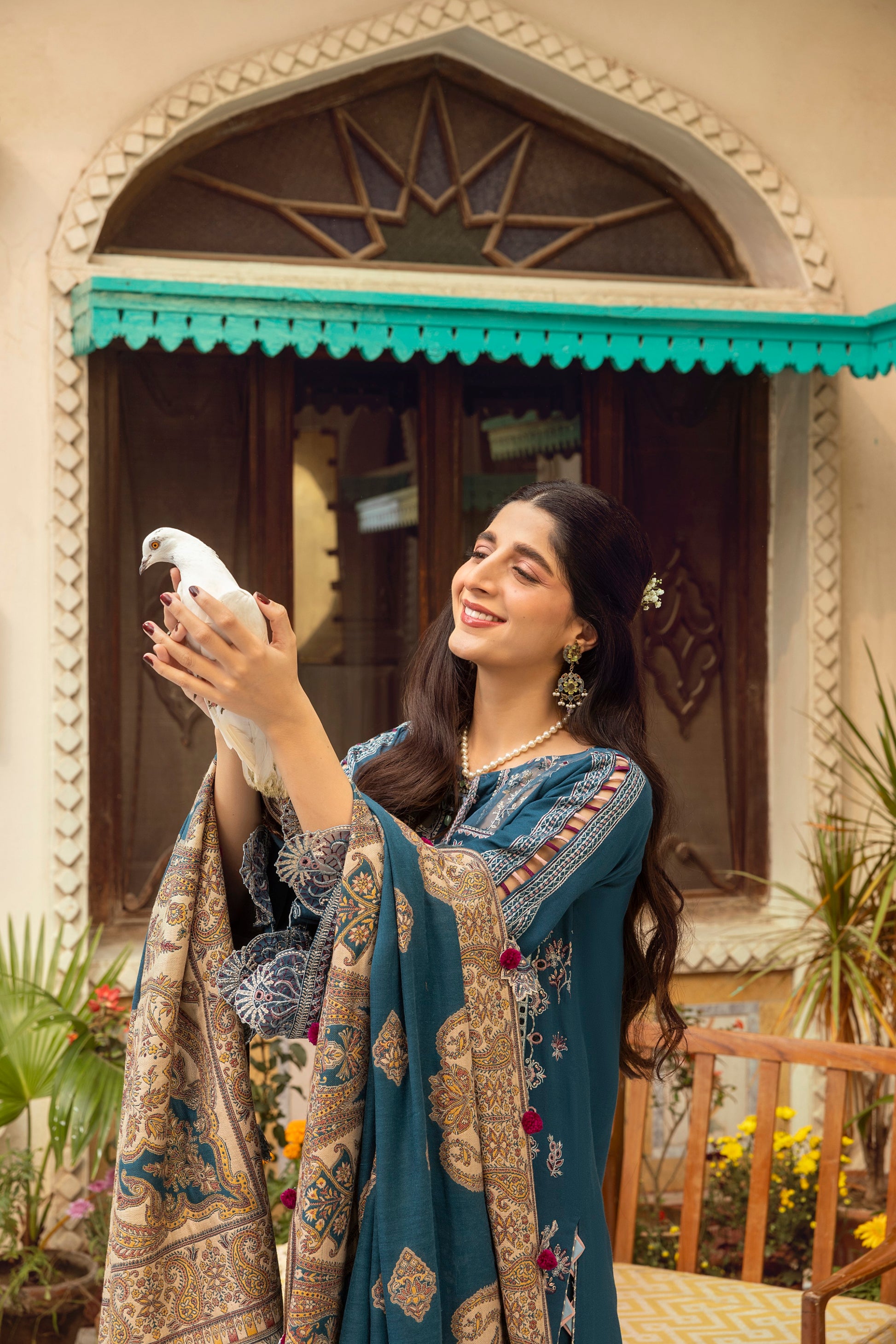 Warm Marina ensemble enhanced with handwoven Kashmiri craftsmanship, embroidered shirt front, and sleek trouser piece.