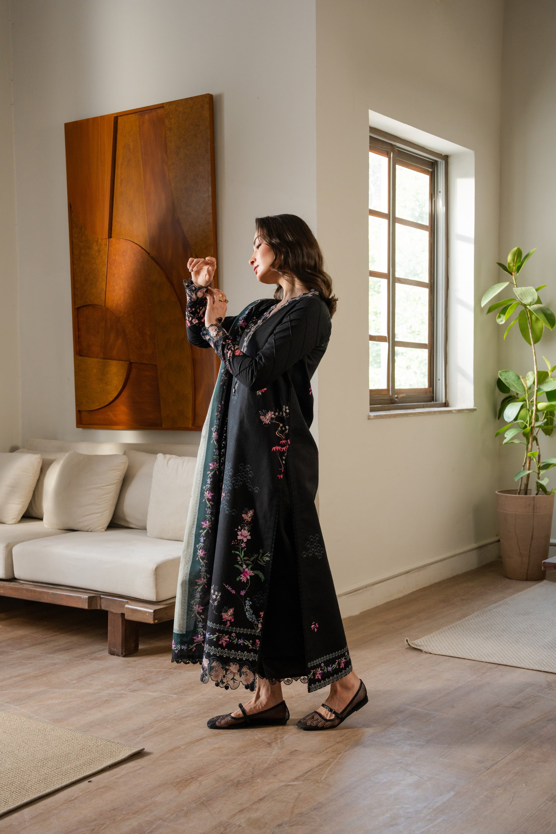 Winter dress featuring embroidered organza neckline, printed khaddar shirt, and neat dyed trousers.