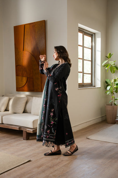Winter dress featuring embroidered organza neckline, printed khaddar shirt, and neat dyed trousers.