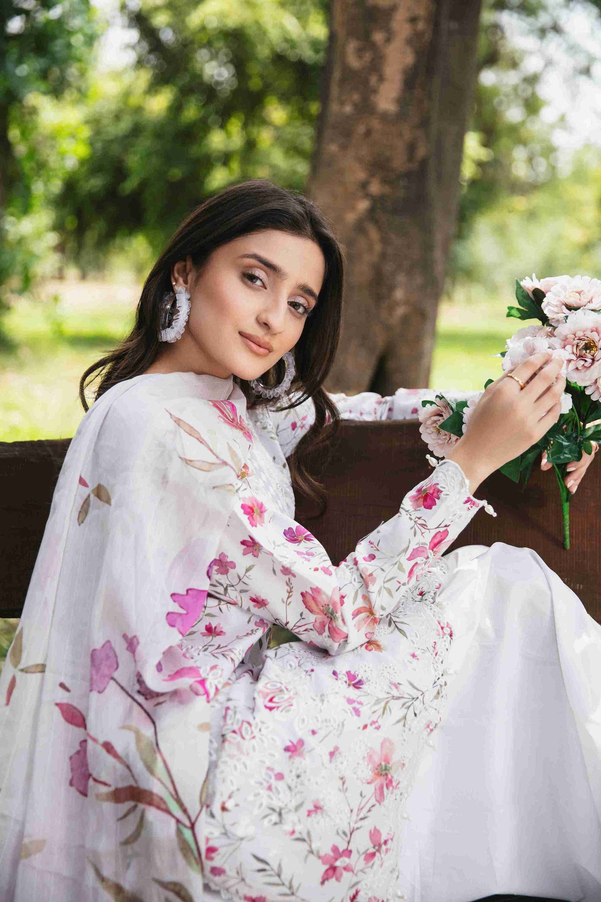 Embroidered lawn shirt styled with chiffon dupatta and cotton plain trouser.