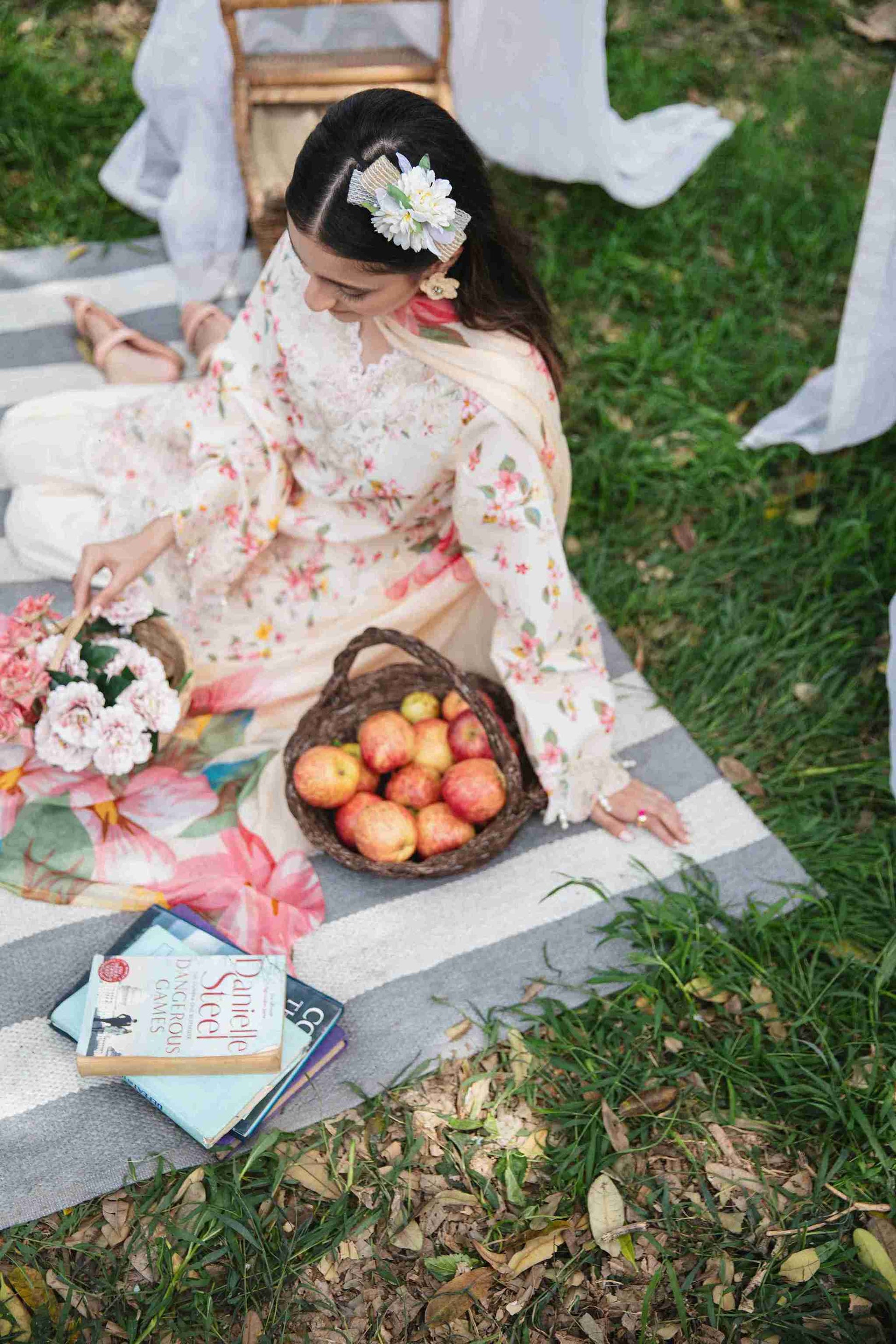 Embroidered lawn suit styled with chiffon dupatta and plain cotton trouser.