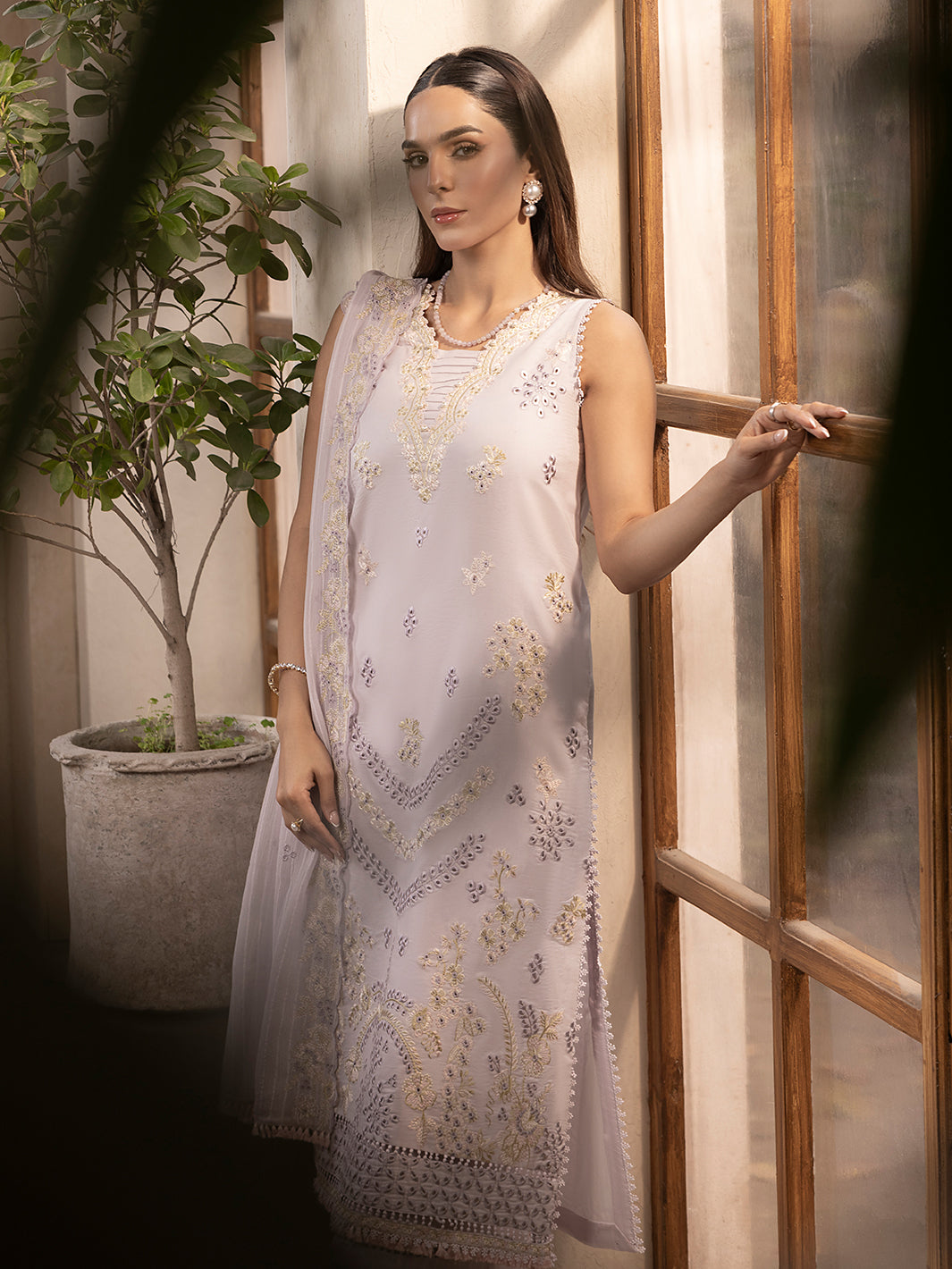 Elegant embroidered lawn suit with printed dupatta, designed for wedding events
