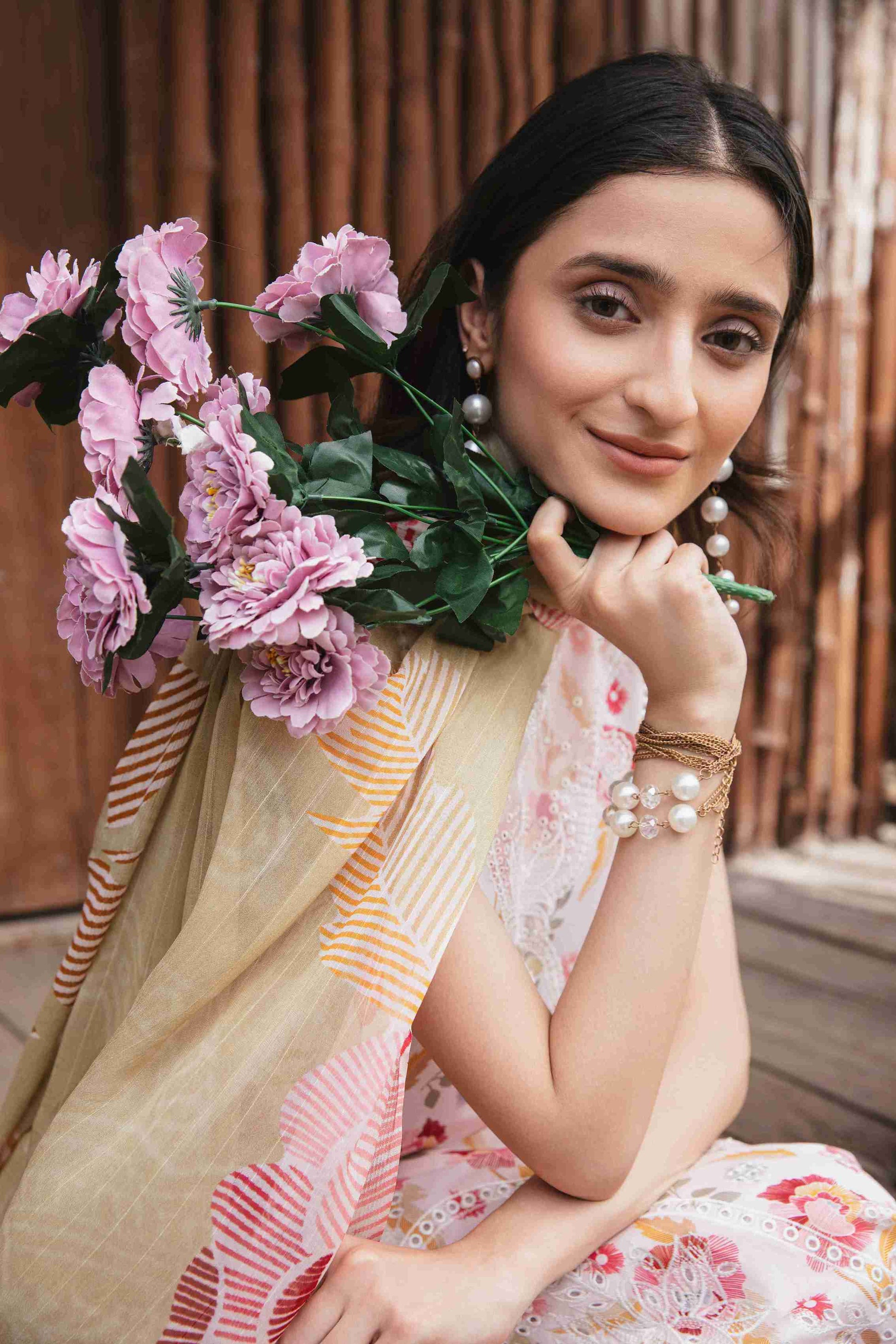  Designer embroidered lawn outfit with chiffon dupatta and plain trouser.