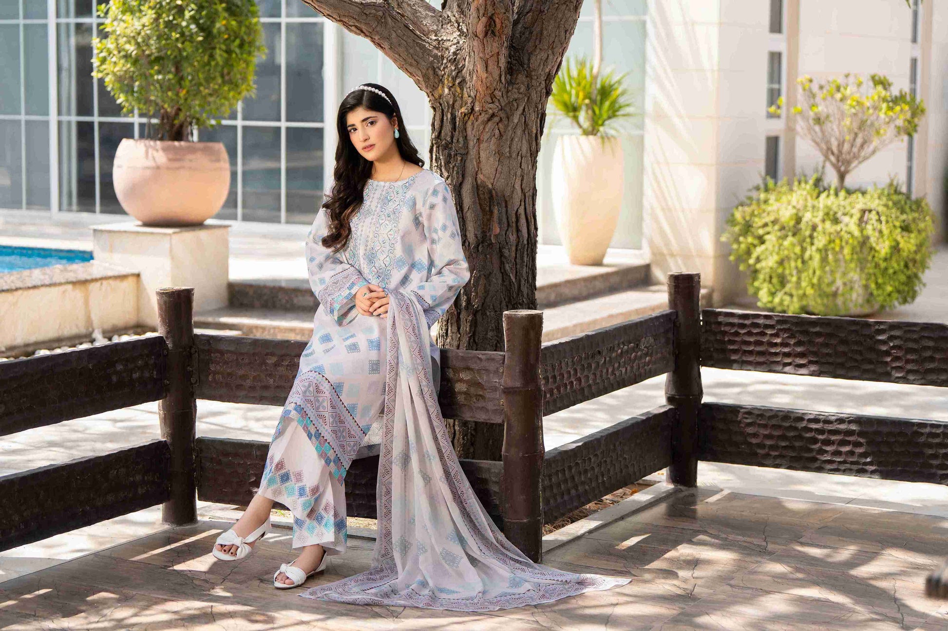 Unique embroidered kurta styled with soft chiffon dupatta and cotton trouser