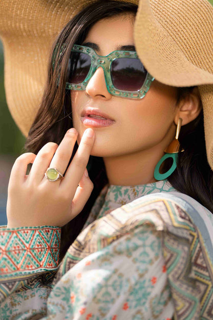 Women’s embroidered neckline lawn kurta styled with chiffon dupatta and trouser