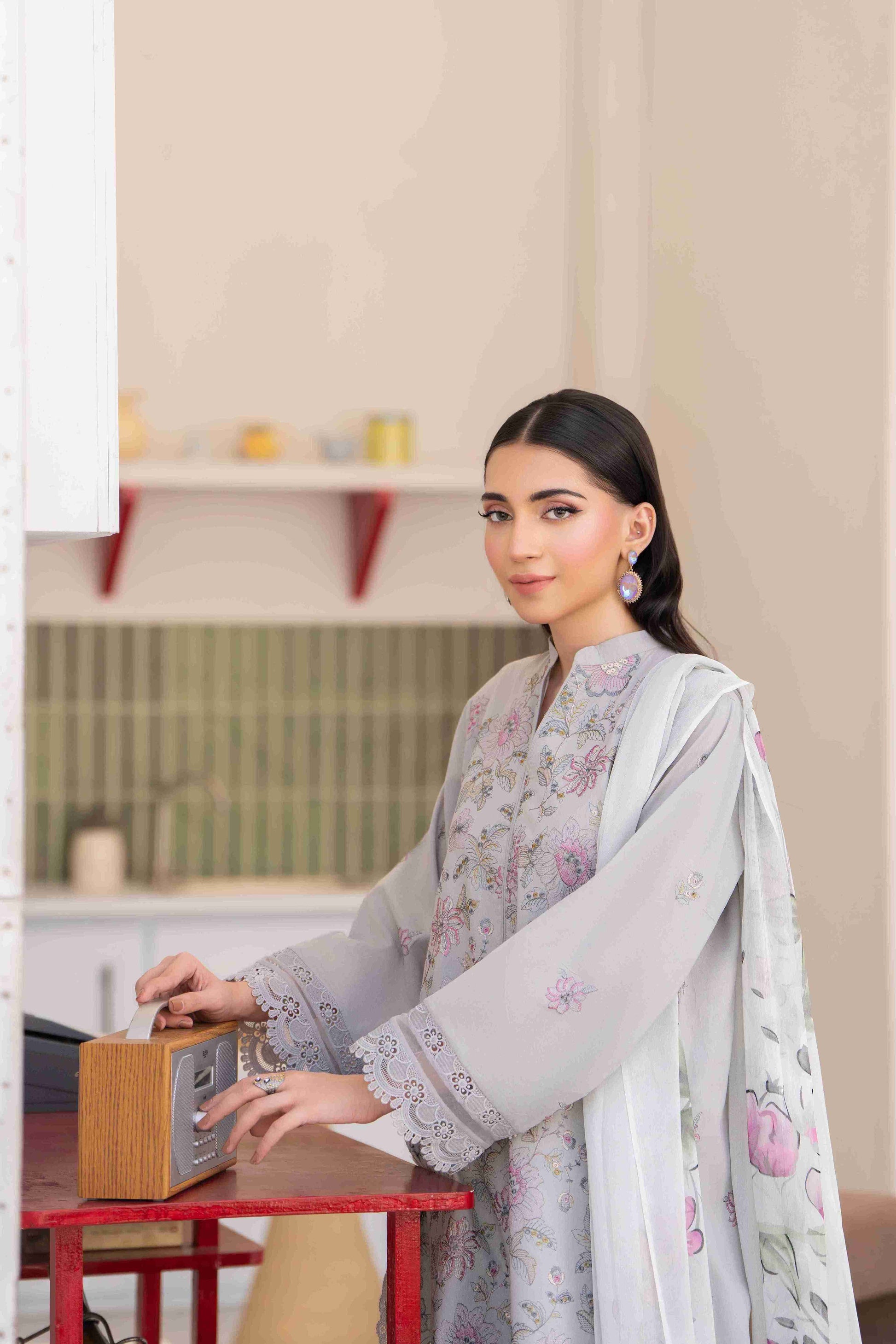 Designer embroidered lawn suit featuring chiffon dupatta two point five meters and cotton trouser