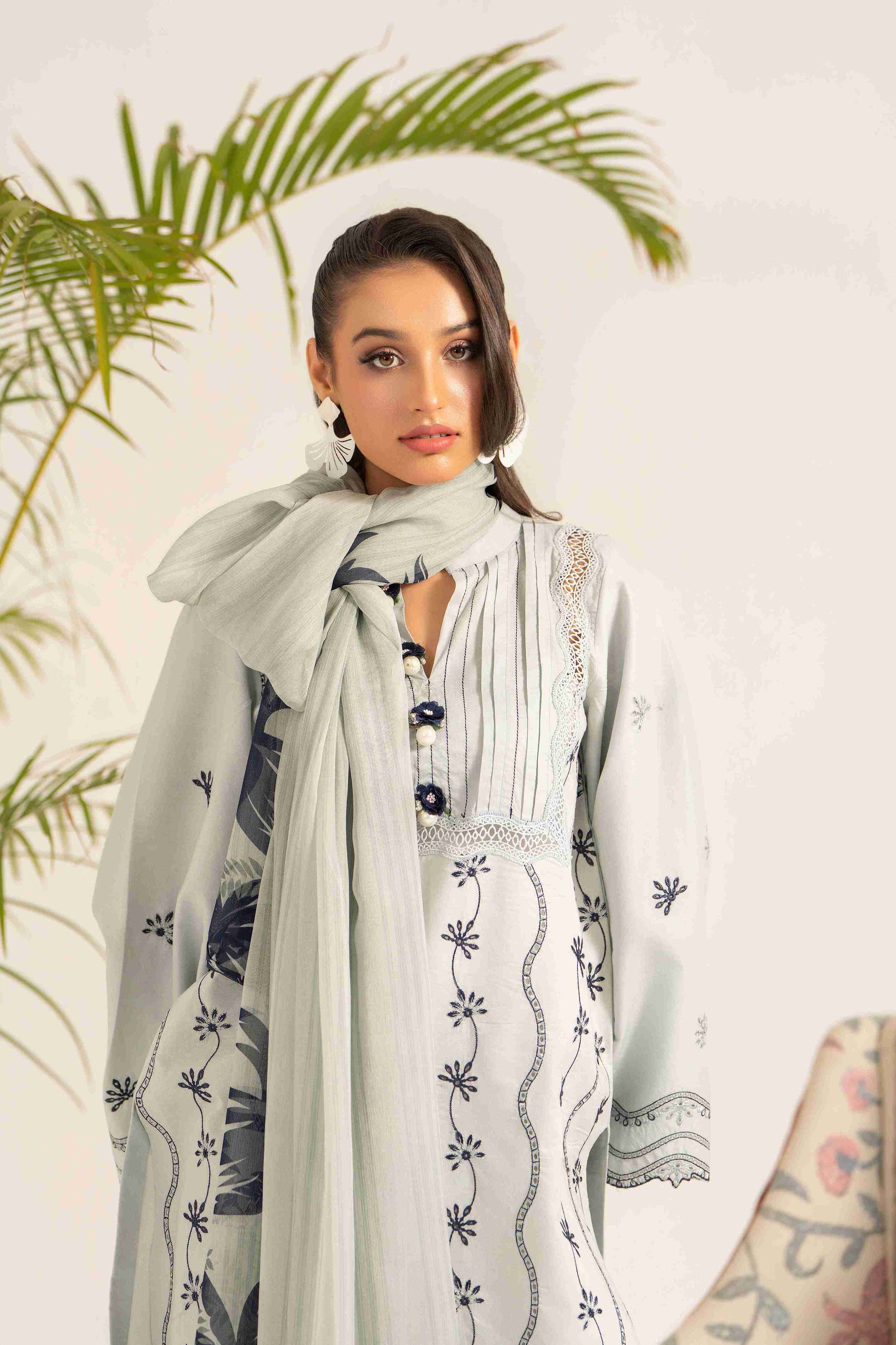 Embroidered lawn shirt styled with chiffon printed dupatta and soft cotton trouser.