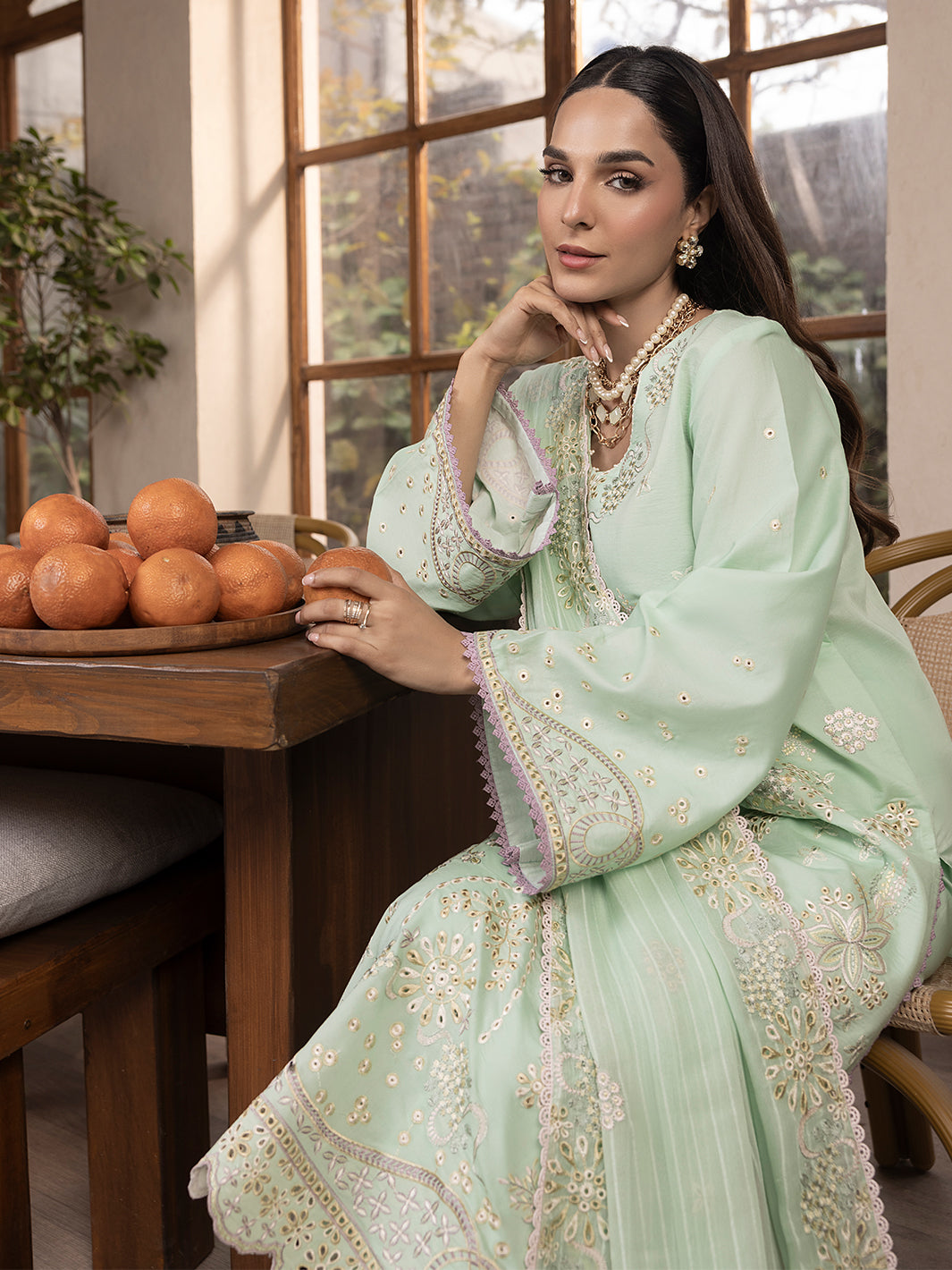 Soft printed lawn kurta with embroidered neckline, styled for young and trendy eastern wear