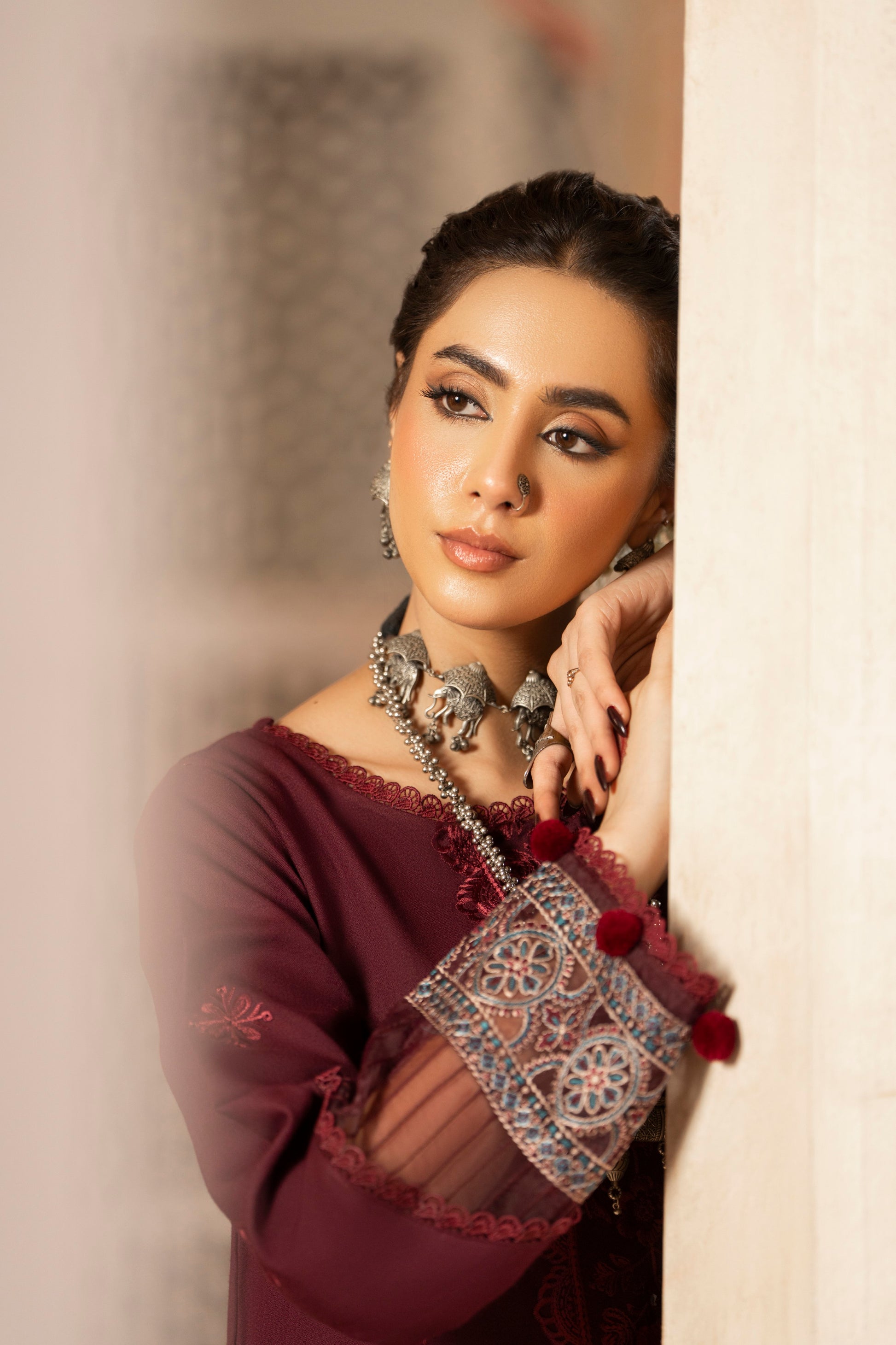 Detailed embroidered Dhanak suit complemented by jacquard wool shawl and plain trousers.
