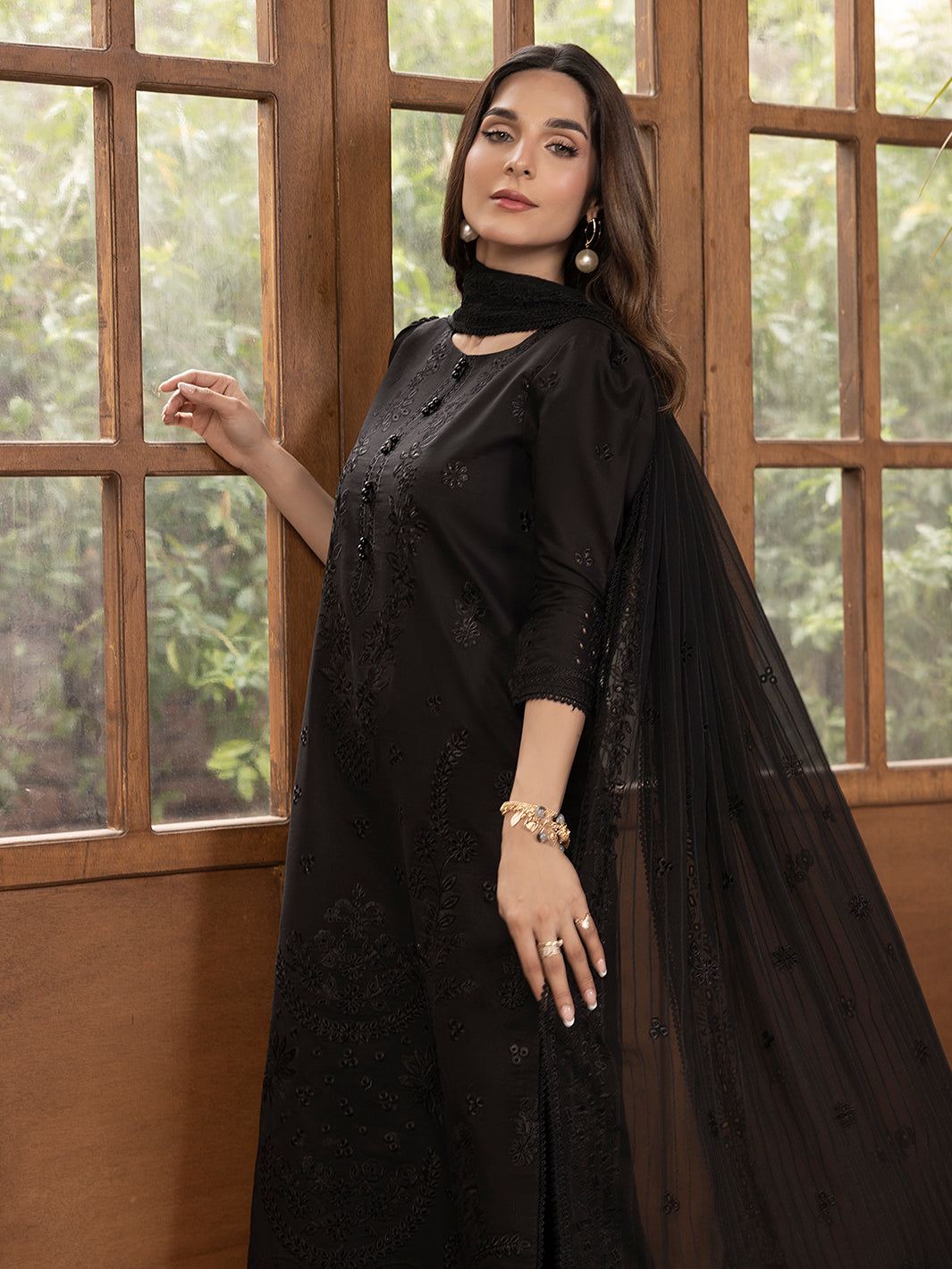 Printed lawn suit by Senerede featuring embroidered patches and stylish detailing