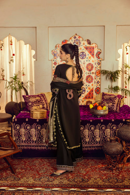 A linen-toned Marina winter dress combined with embroidered frontwork and a handwoven Kashmiri shawl.