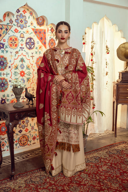 A floral-toned winter suit featuring Marina embroidery and a delicately designed Kashmiri handloom shawl.