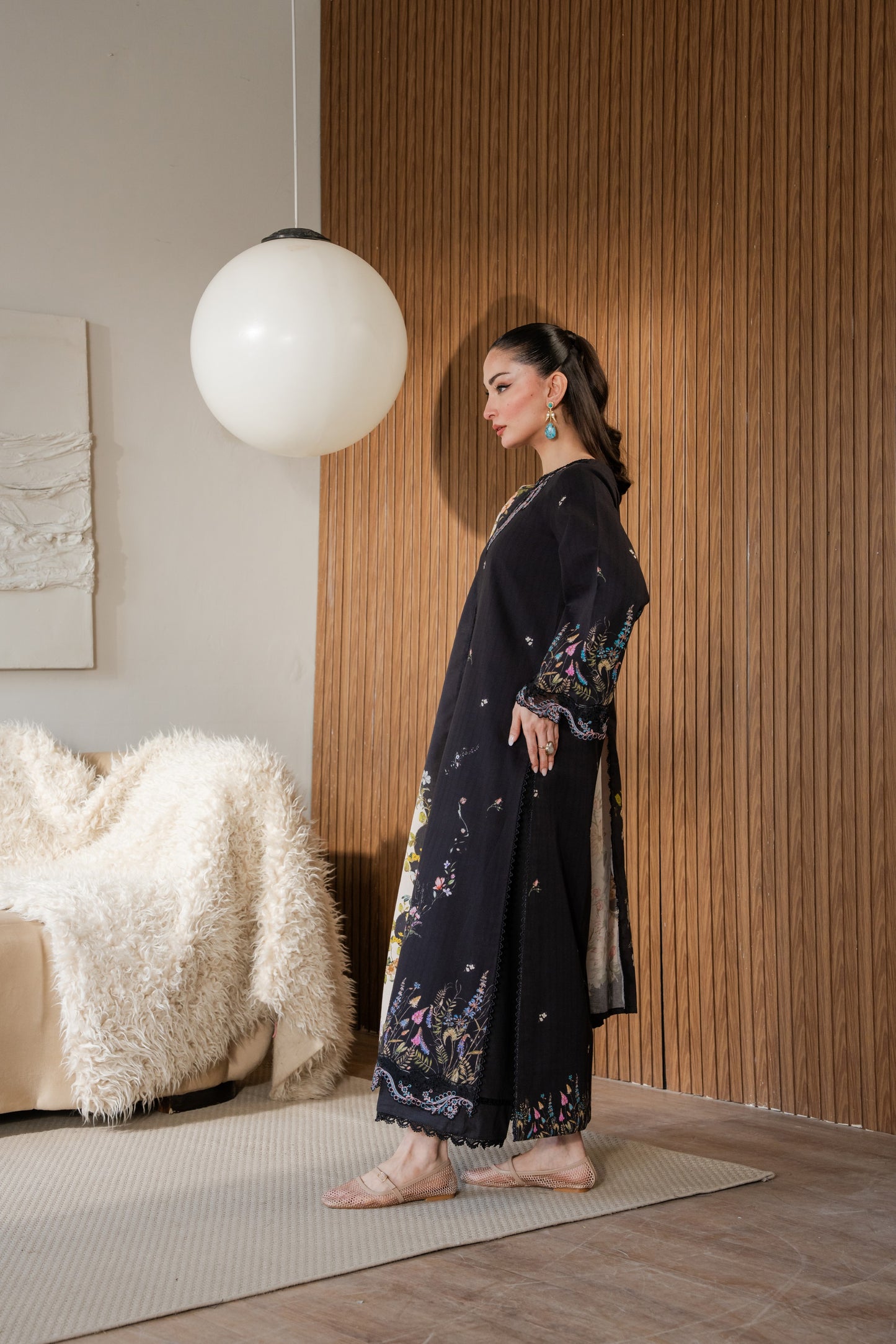 Plain winter khaddar dress with light organza embroidery and dyed trousers.