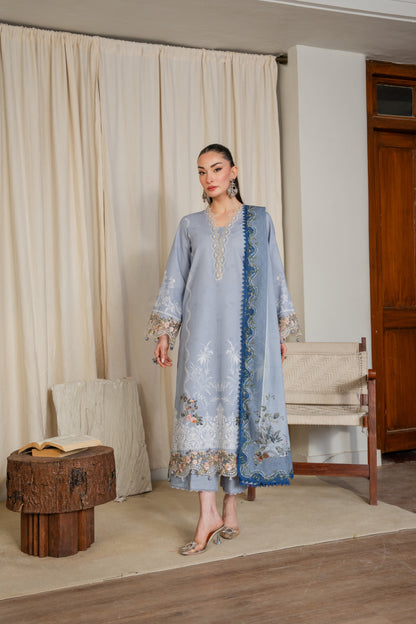 Winter-ready khaddar dress with organza details and dyed trousers.