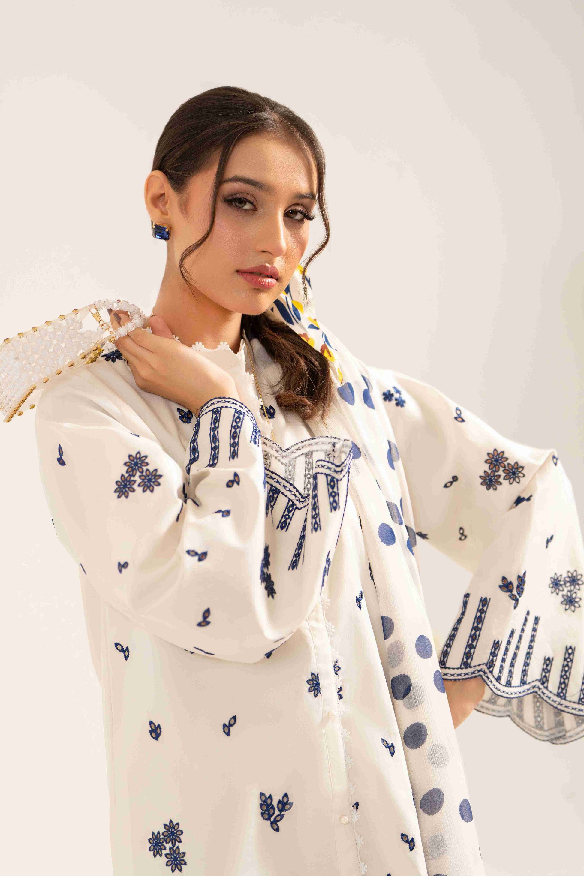 Soft embroidered lawn shirt matched with chiffon digital dupatta and cotton trouser.