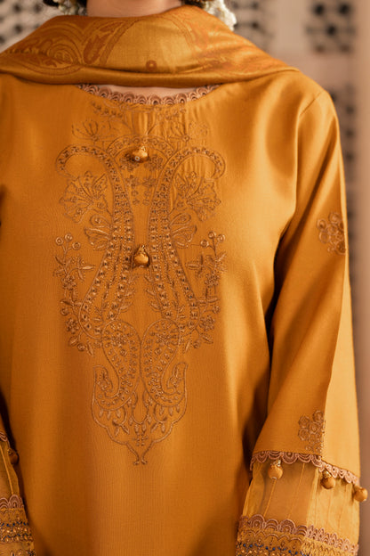 Winter-ready 3PC dress featuring Dhanak embroidery paired with a soft jacquard wool shawl.