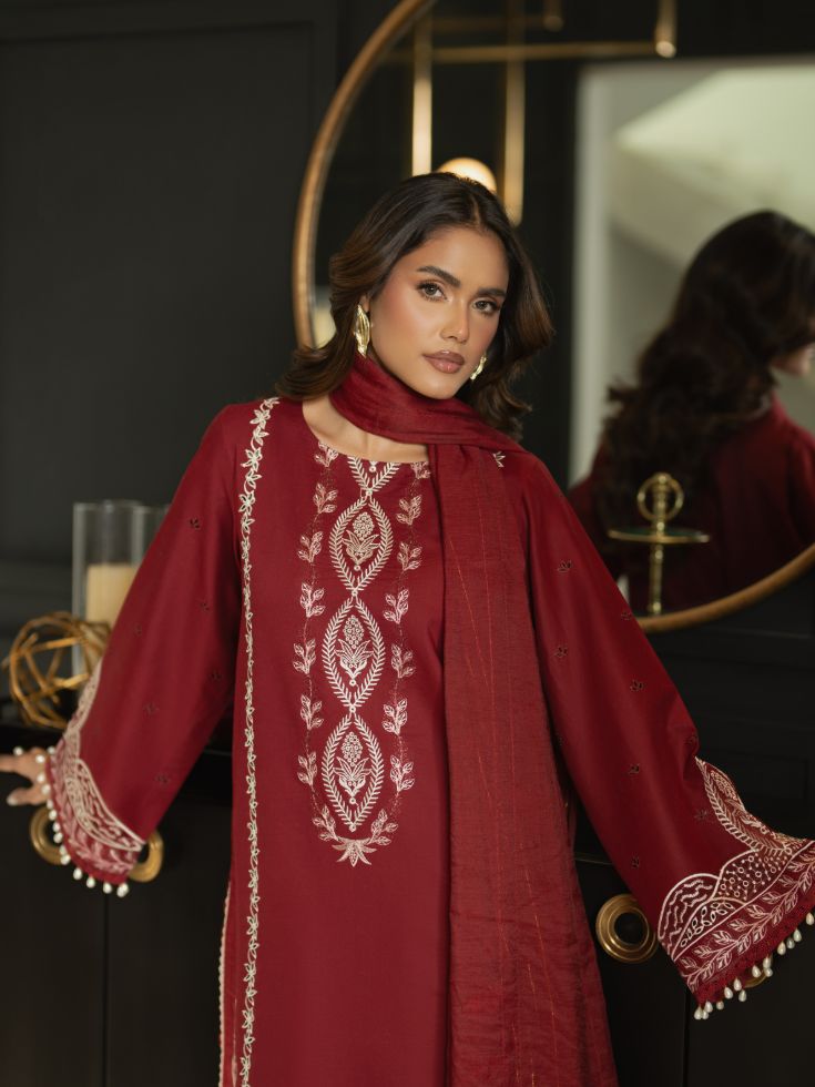 ESmbroidered suit with plain dyed back, motifs, organza patches, and cotton dupatta