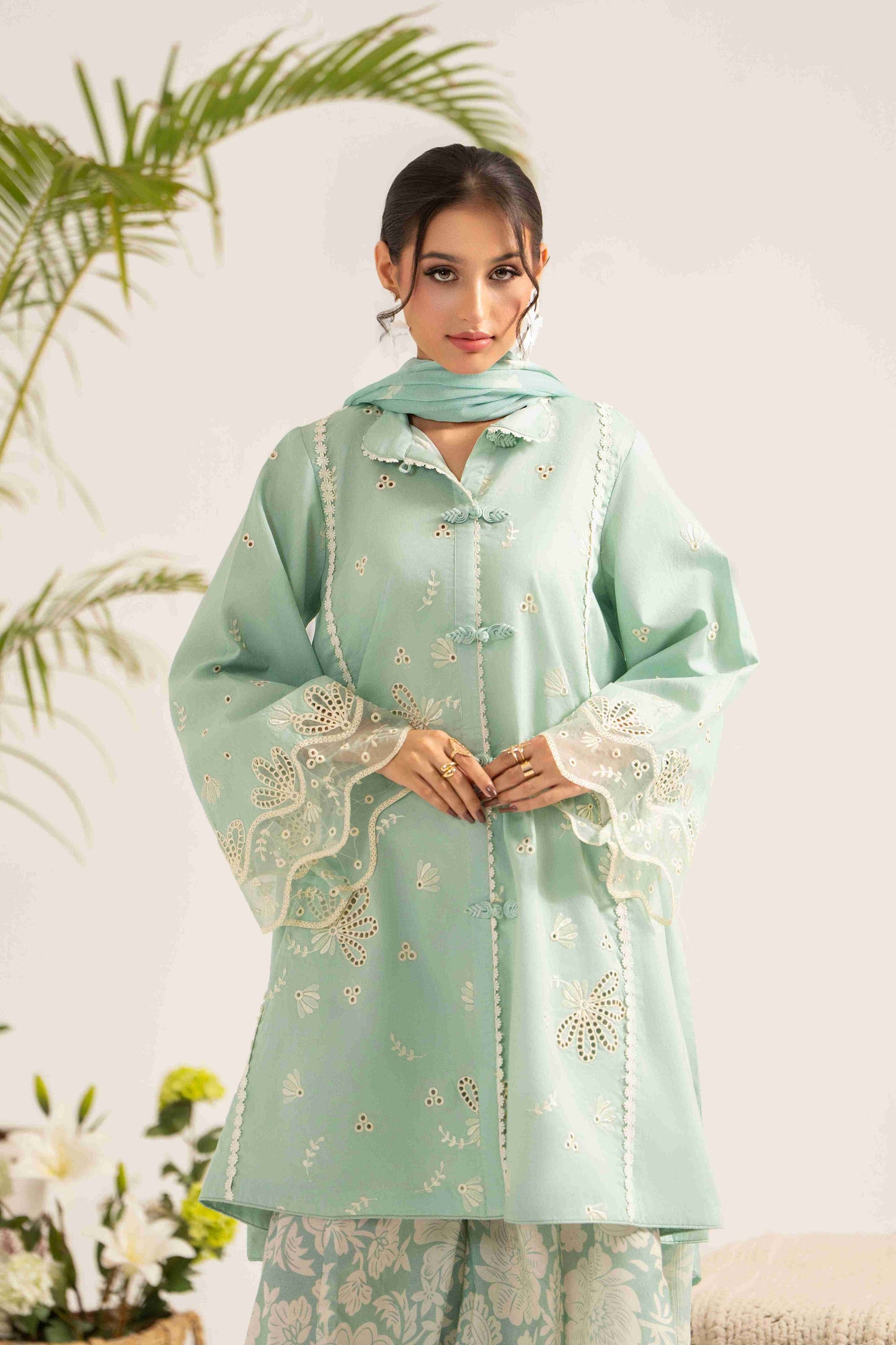 Stylish embroidered lawn shirt paired with chiffon dupatta and soft cotton trouser.