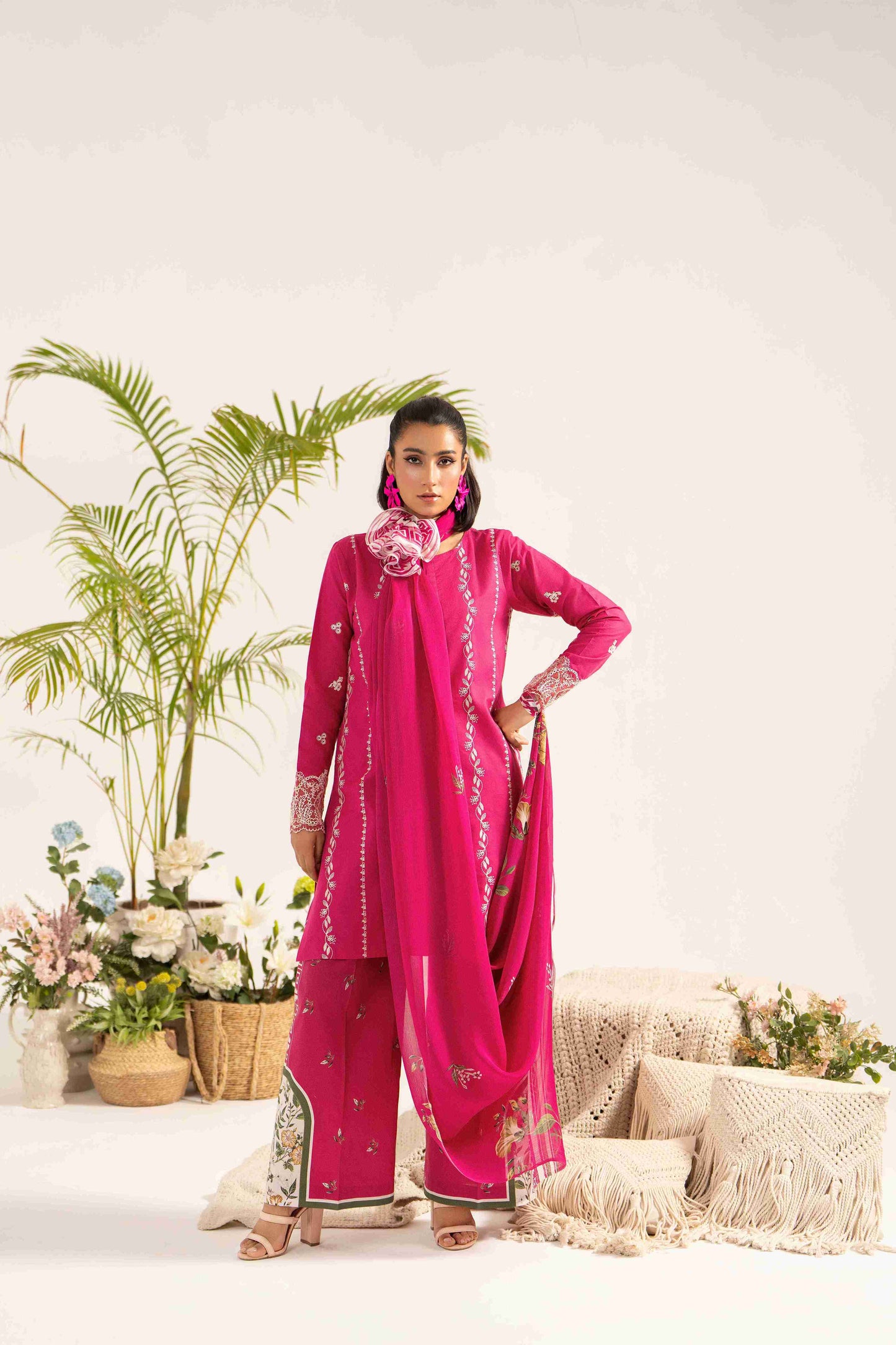 Stylish embroidered lawn shirt styled with chiffon dupatta and plain cotton trouser.