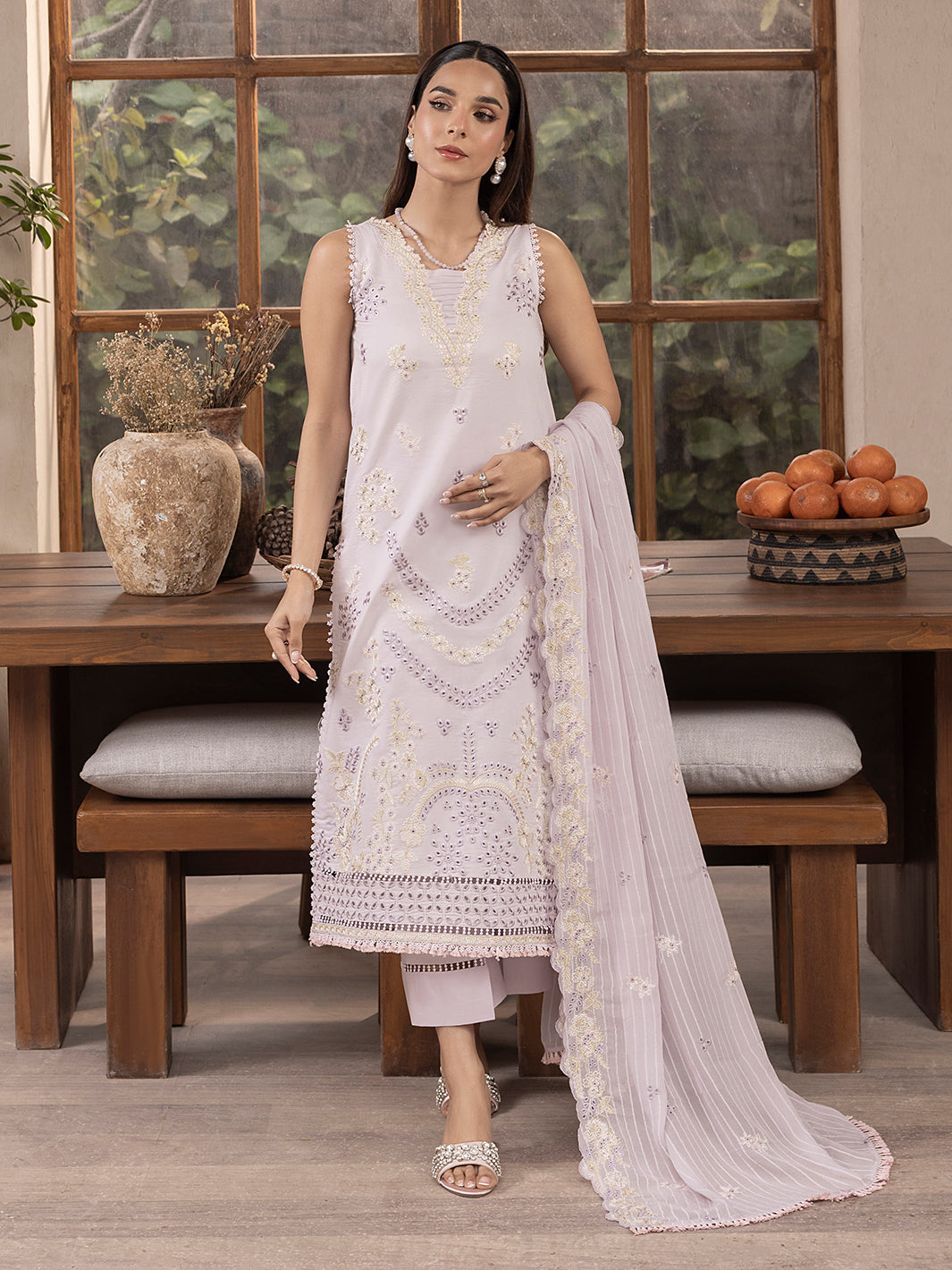 Fancy embroidered lawn kurta styled with premium patches for formal occasions