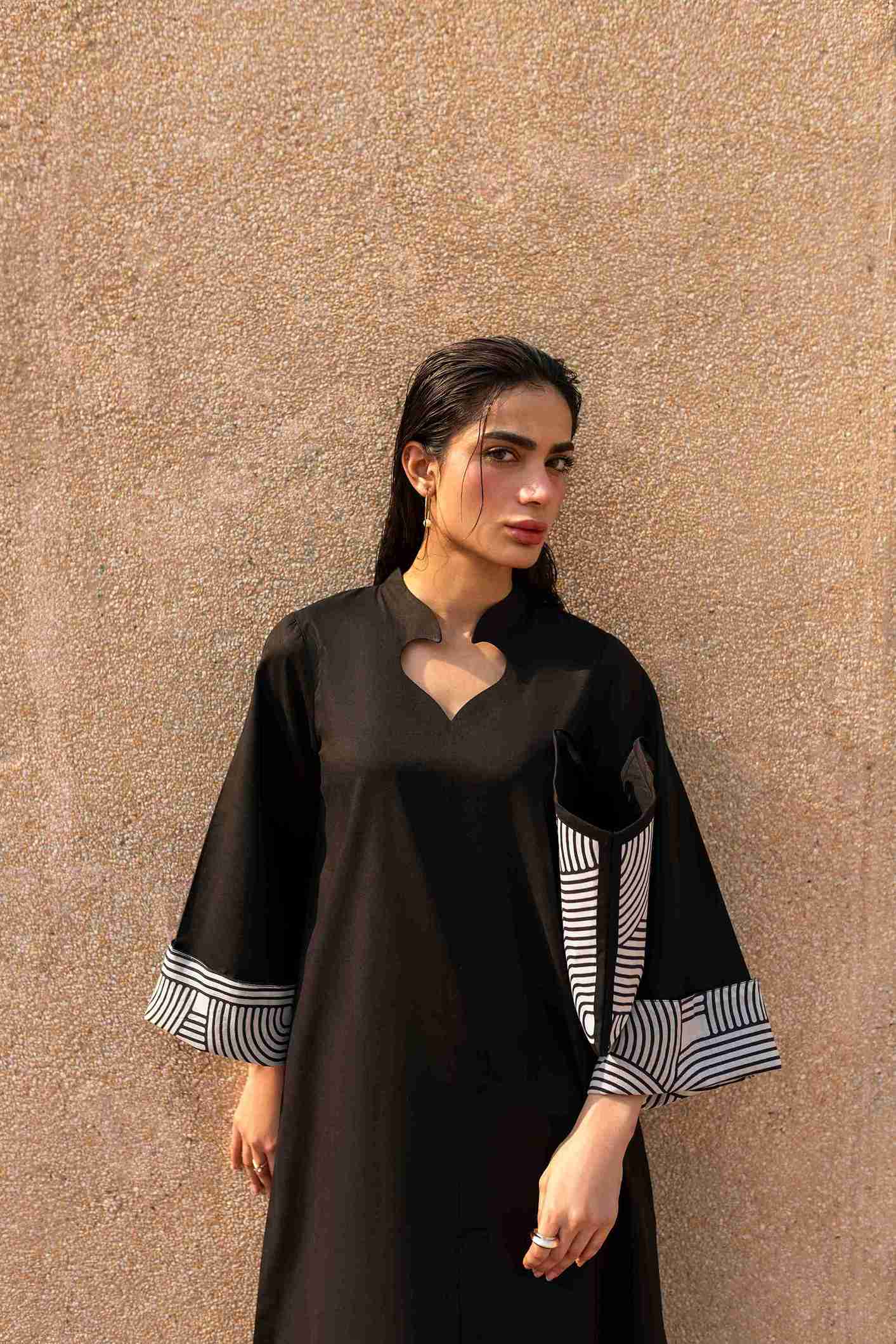 Premium printed Jacquard kurta with crisscross neckline paired with cotton trousers