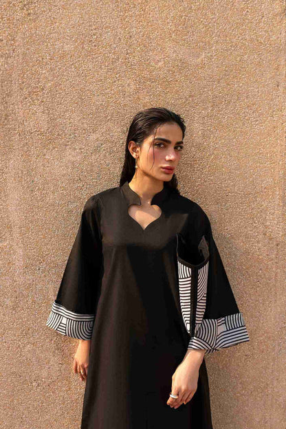 Premium printed Jacquard kurta with crisscross neckline paired with cotton trousers