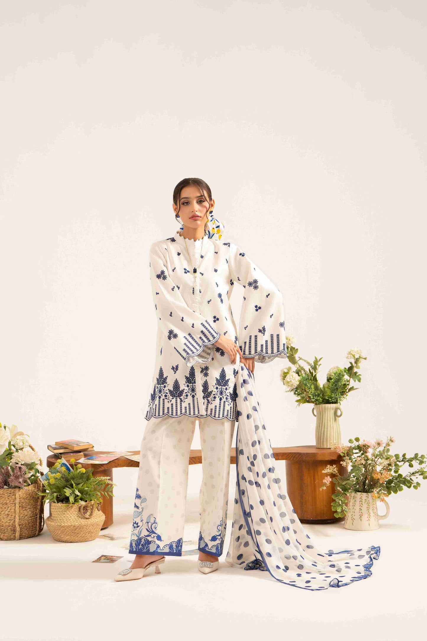 Stylish embroidered lawn shirt with chiffon dupatta and plain dyed cotton trouser.
