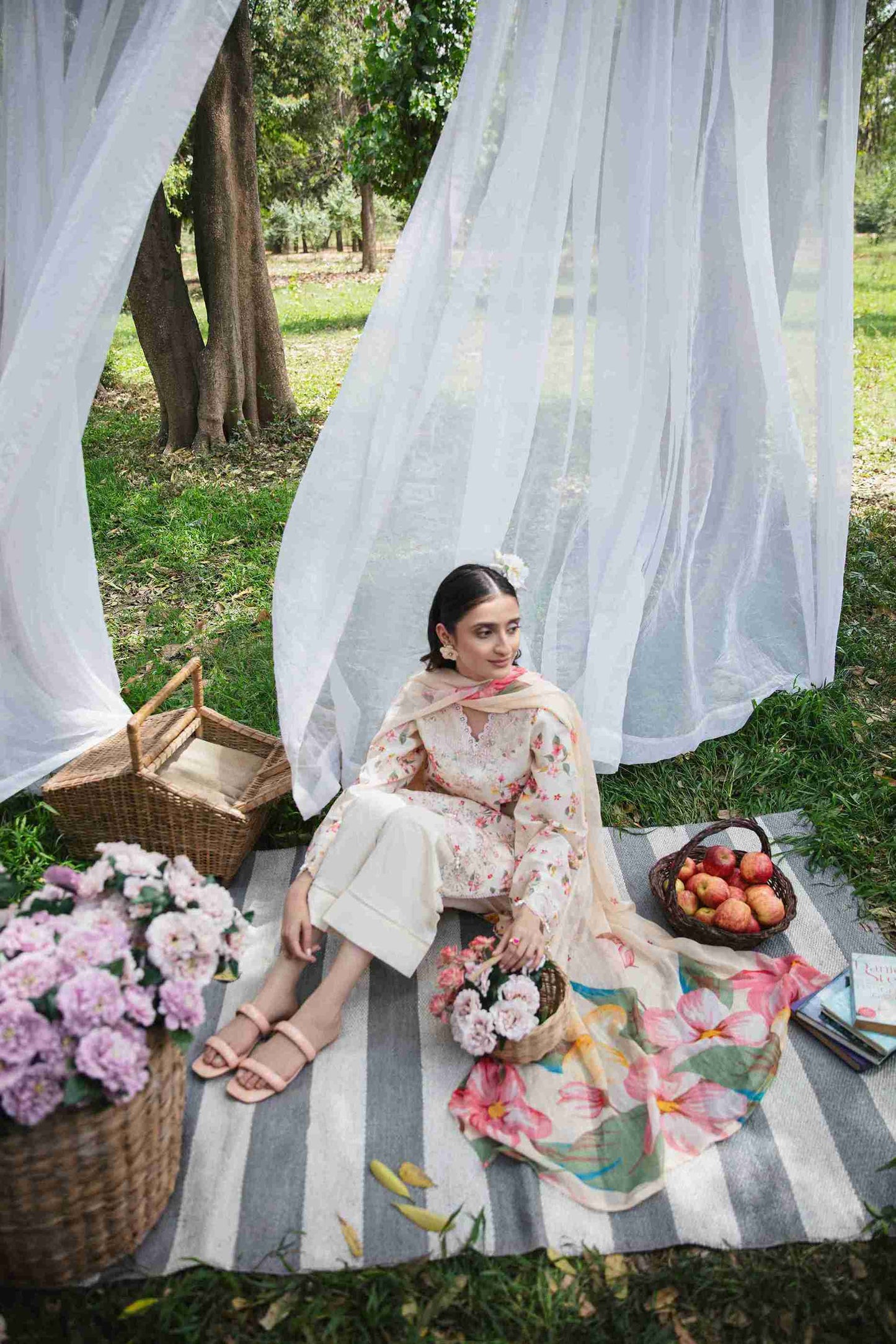 Embroidered lawn outfit styled with chiffon dupatta and cotton trouser.
