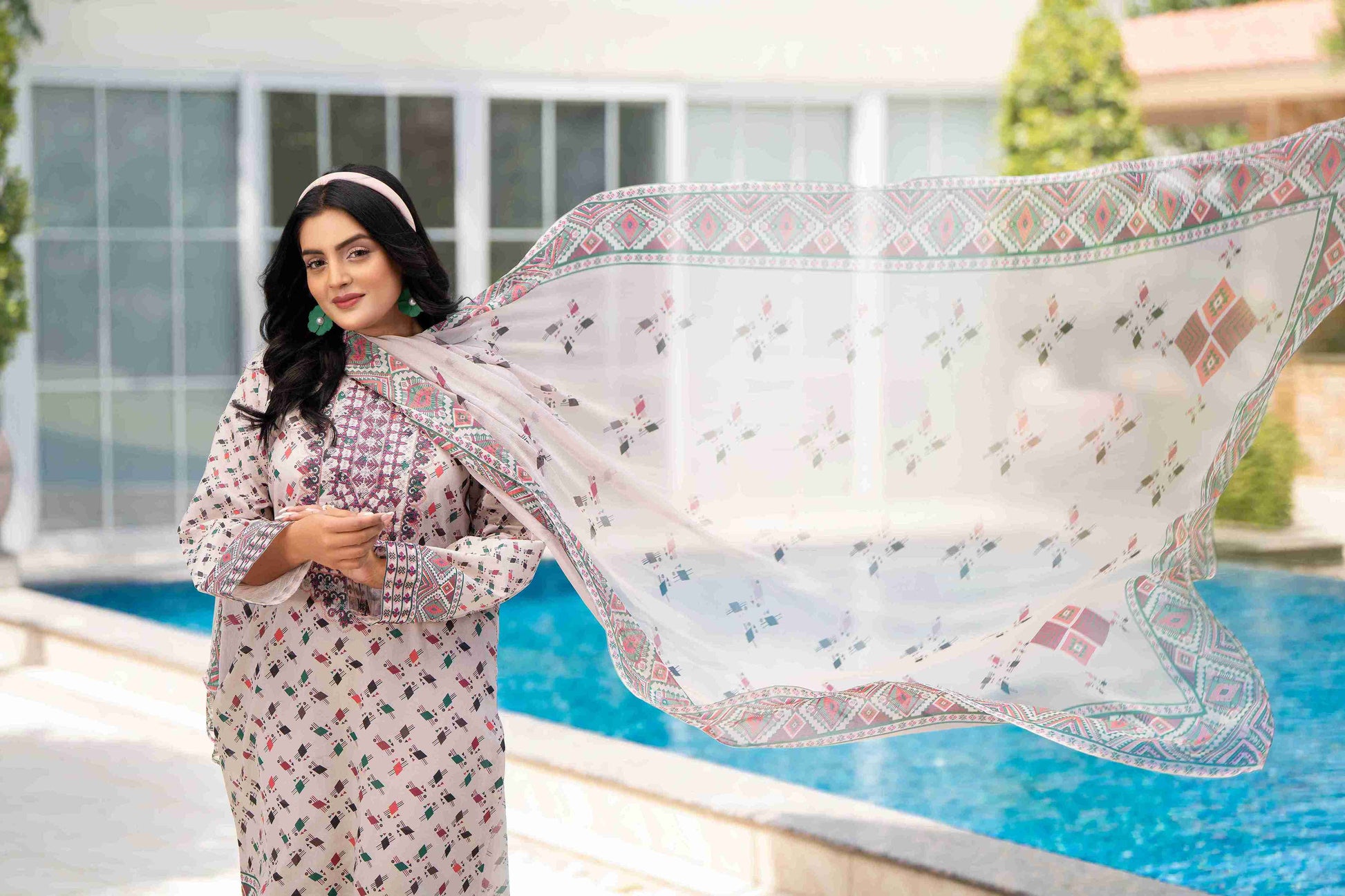 Elegant embroidered kurta with chiffon dupatta and cotton trouser, styled for summer gatherings