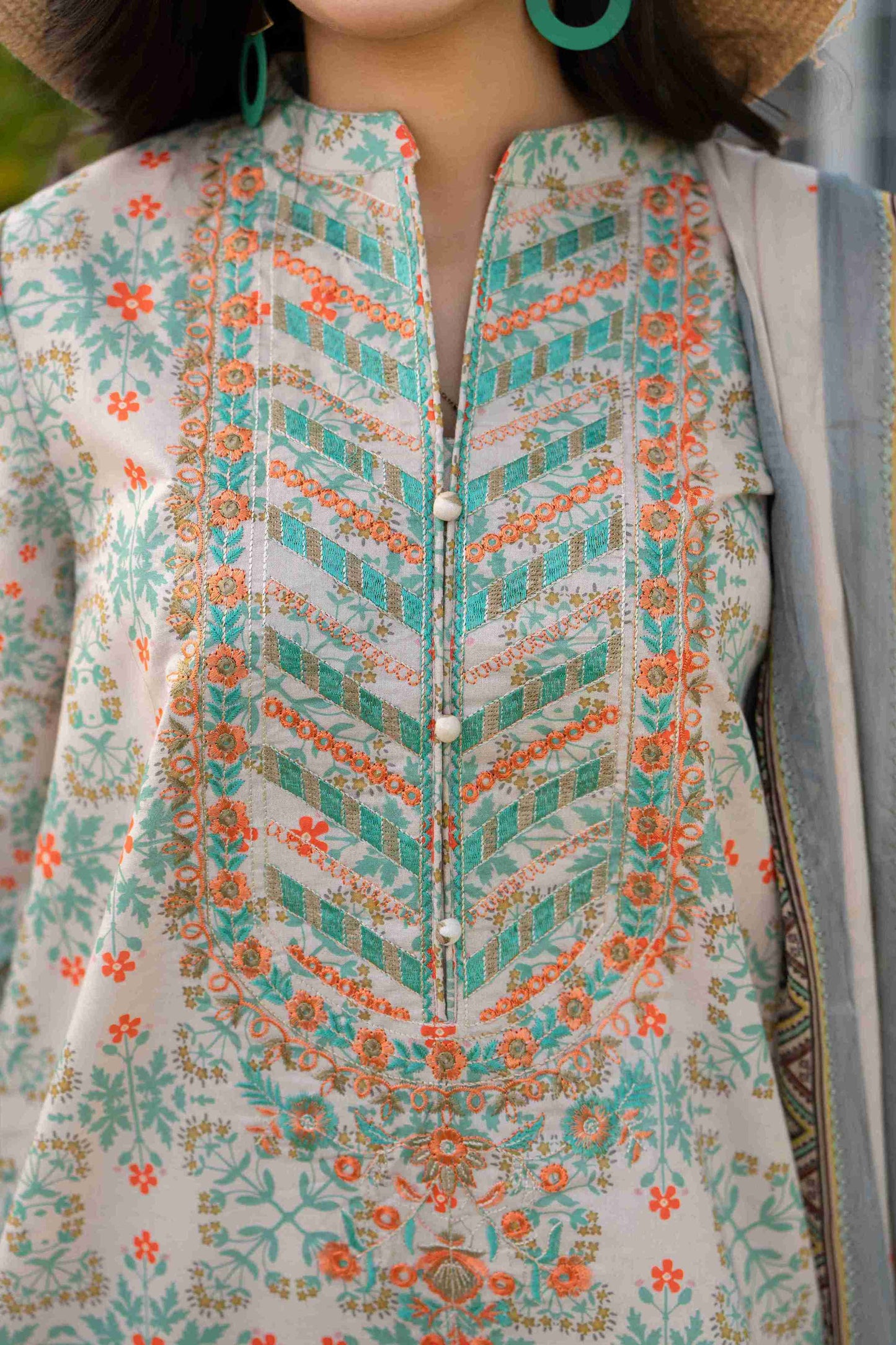 Premium lawn outfit with embroidered details, chiffon dupatta, and cotton trouser for everyday wear