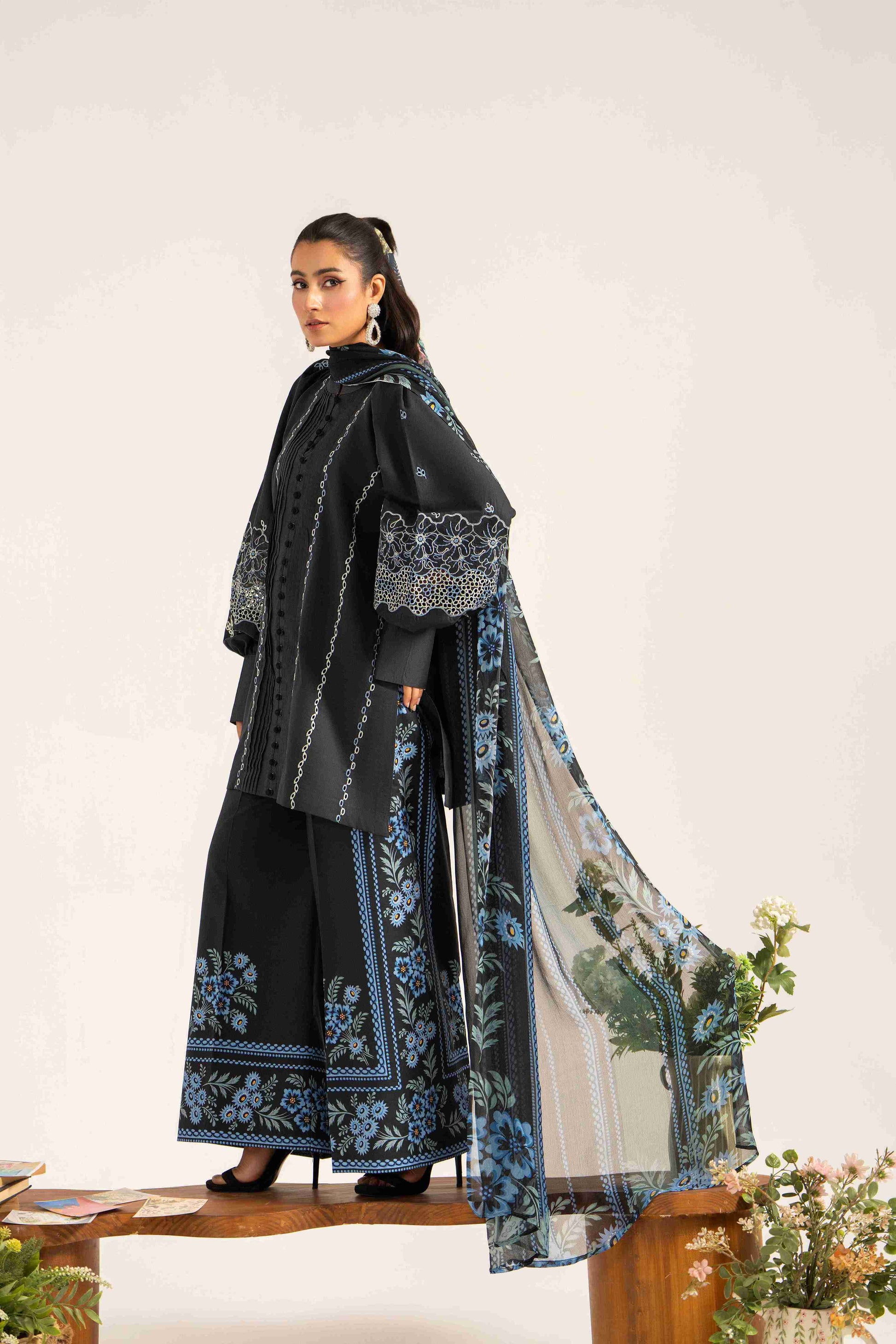 Elegant embroidered lawn shirt styled with chiffon printed dupatta and plain trouser.