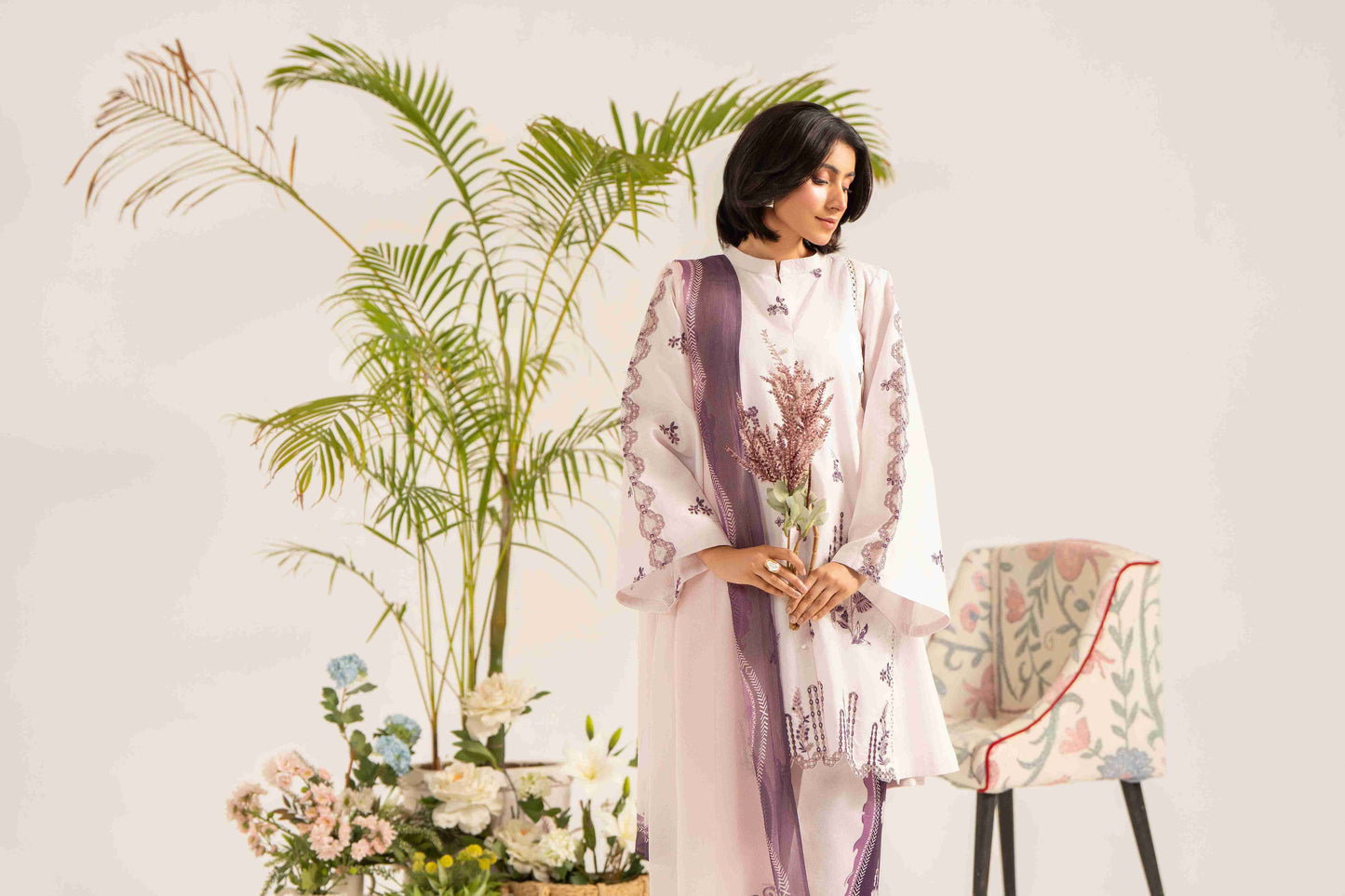 Trendy embroidered lawn shirt styled with chiffon printed dupatta and plain trouser.